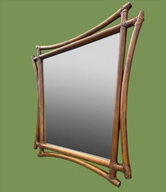 An unusual shaped 1970s wood and leather mirror in the style of Vivai Del Sud