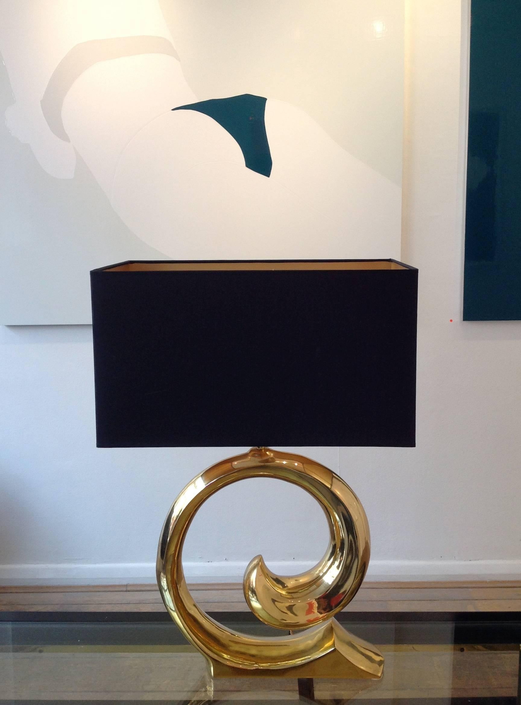 A pair of large Pierre Cardin lamps, moulded in brass after the Pierre Cardin swirling logo. With bespoke, new, black, rectangular shades with gold interiors.
Re wired with antique black flex and PAT tested for UK fittings.