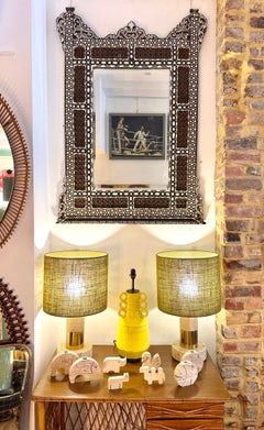 A pair of Studio Smania Italian 1970s travertine and brass lamps