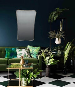 An Italian 1950s shaped brass frame mirror with decorative beaded edge detail