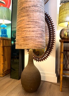 A large French 1960S biscuit fired pottery floor lamps with orignal shade.