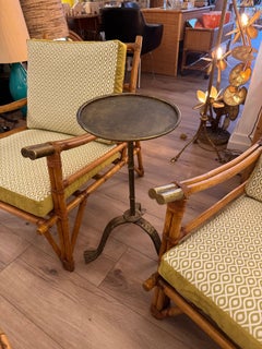 A Spanish 1950s gilt wrought iron martini table with three shaped legs