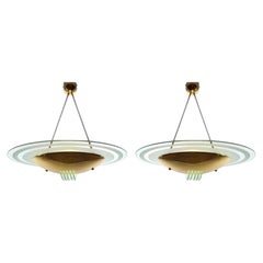 A pair of Italian 1970s brass and etched glass ceiling lights by Lamperti