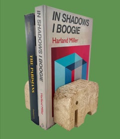 A pair of Fratelli Mannelli Italian Rapolano travertine elephant book ends