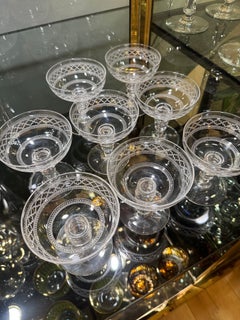 A set of 8 French 1950s Baccarat style etched crystal coupes.