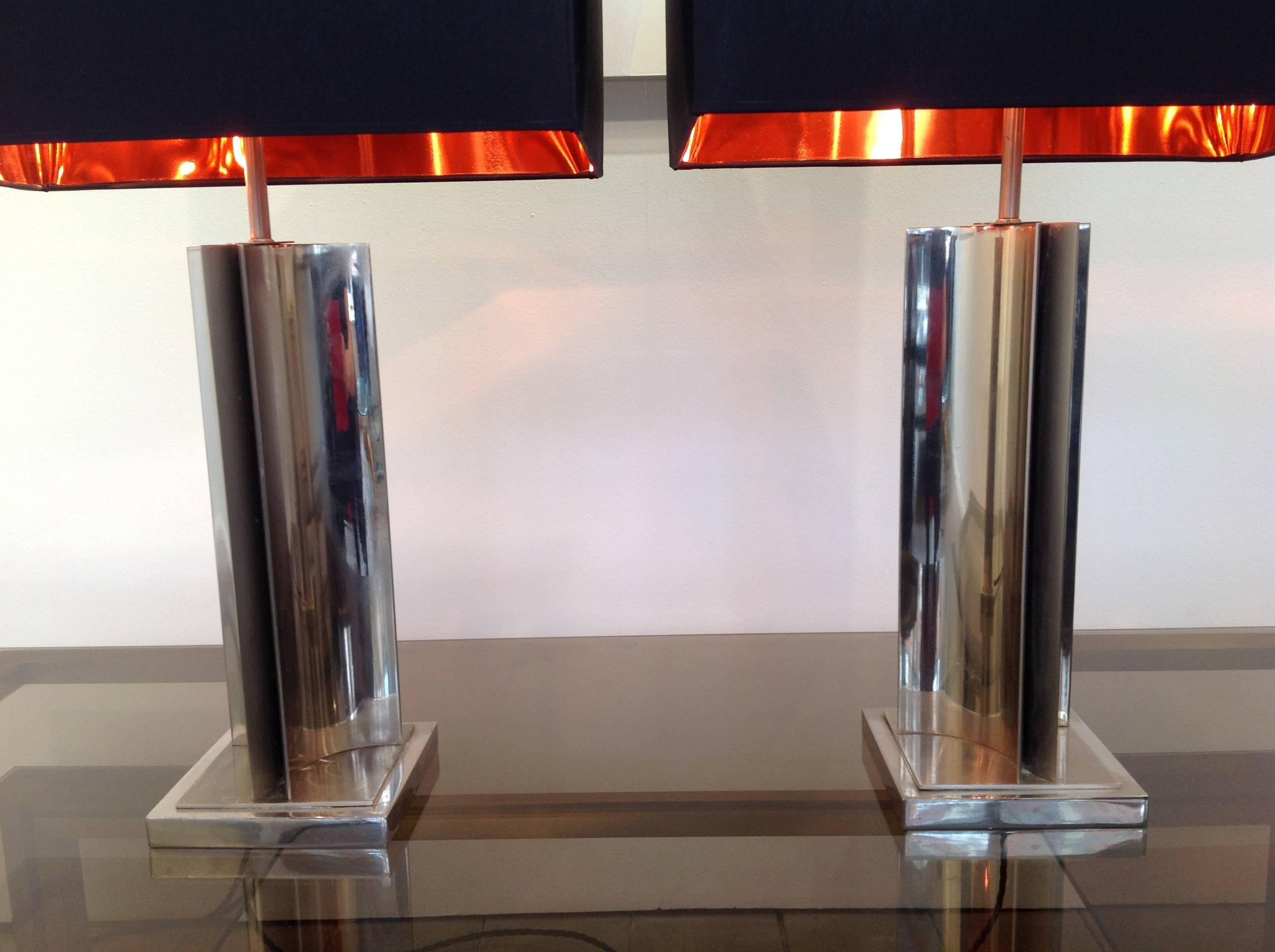 A pair of interesting chrome lamps, each one with two bulb fittings and chrome shade holder. Re wired with black cord flex and pat tested for UK fittings. Sold without shades.
new bespoke black square shades with copper linings can be ordered as