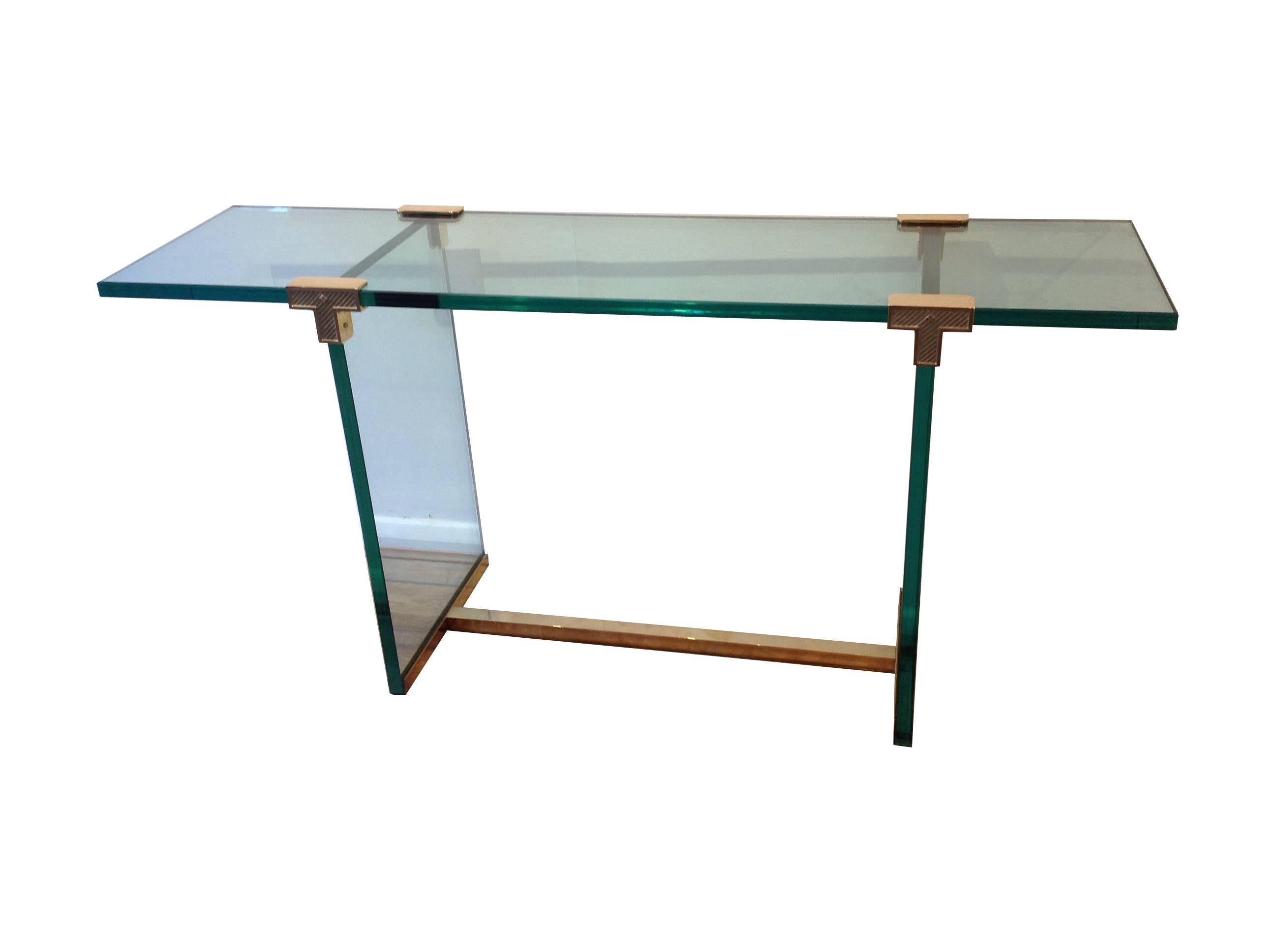 A Peter Ghyczy console with thick 2.4cm glass and sand cast brass fittings and base. Designed by Hungarian architect and designer Peter Ghyczy who moved to Germany to study architecture and later moved to the Netherlands where he produced a large