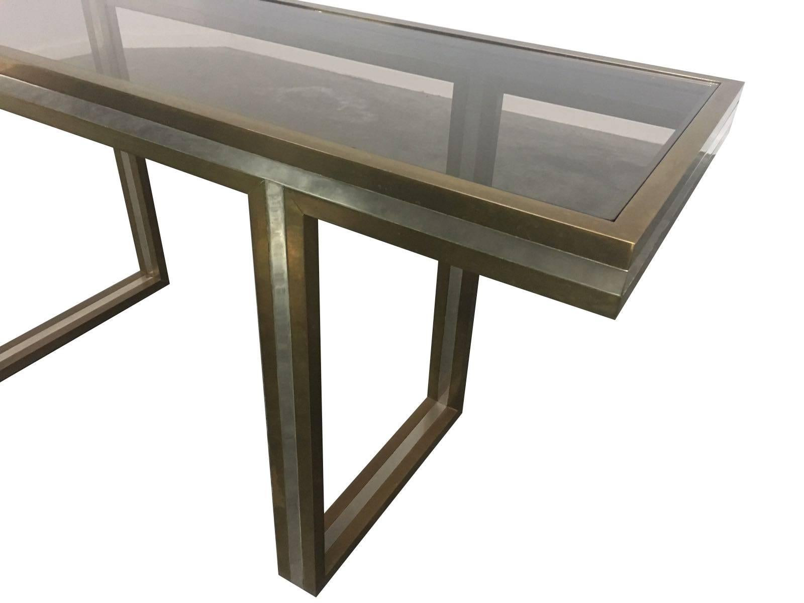 A Romeo Rega brass and chrome console table, with smoked glass top. The brass has original patina so could be polished up if required. Also see matching large coffee table too.