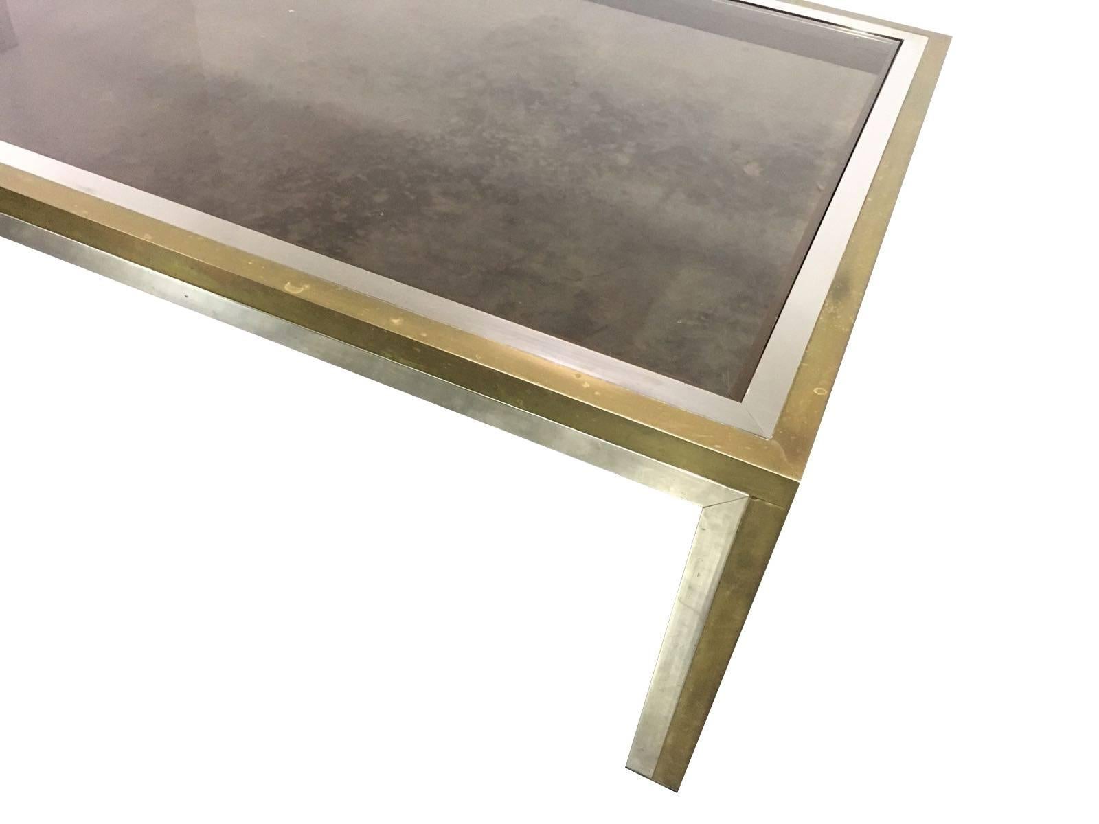 A large Romeo Rega coffee table in chrome and brass, with smoked glass top. The patina on the brass is original so could be polished up if required. See also other listing for a matching console.