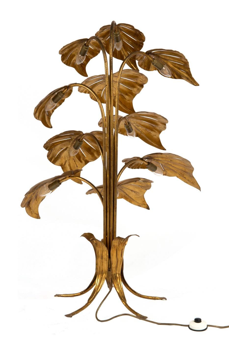 A beautiful French gilt metal plant floor lamp, with ten large leaves each with a bulb underneath, supported by gilt metal stem and base. Re-wired and PAT tested with antique gold cord flex, foot switch and PAT tested.