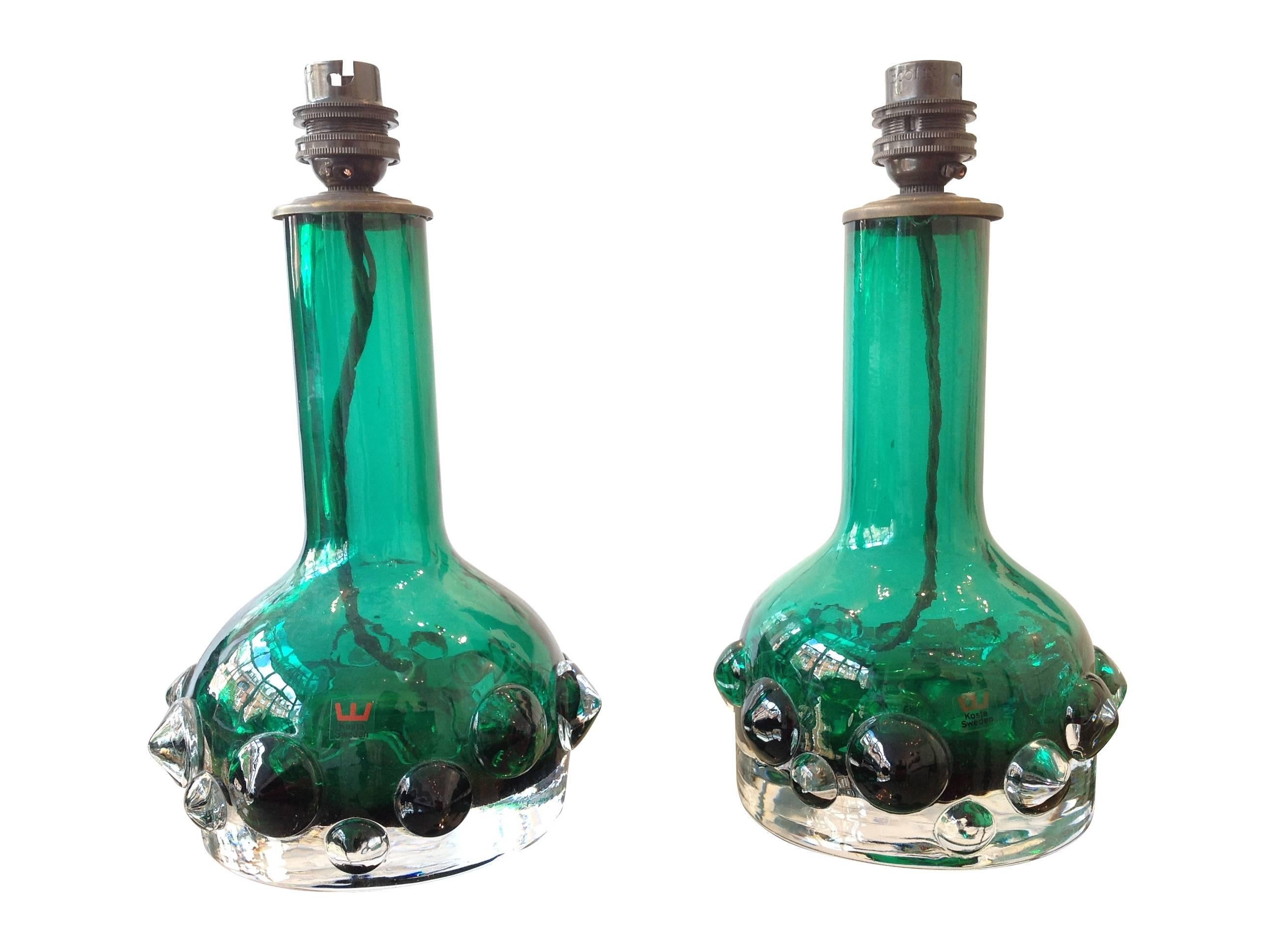 A pair of lamps by Kosta Boda of Sweden with green bobble glass bases and brass fittings. With original Kosta, Sweden labels. Re-wired with antique gold flex and PAT tested . 

.