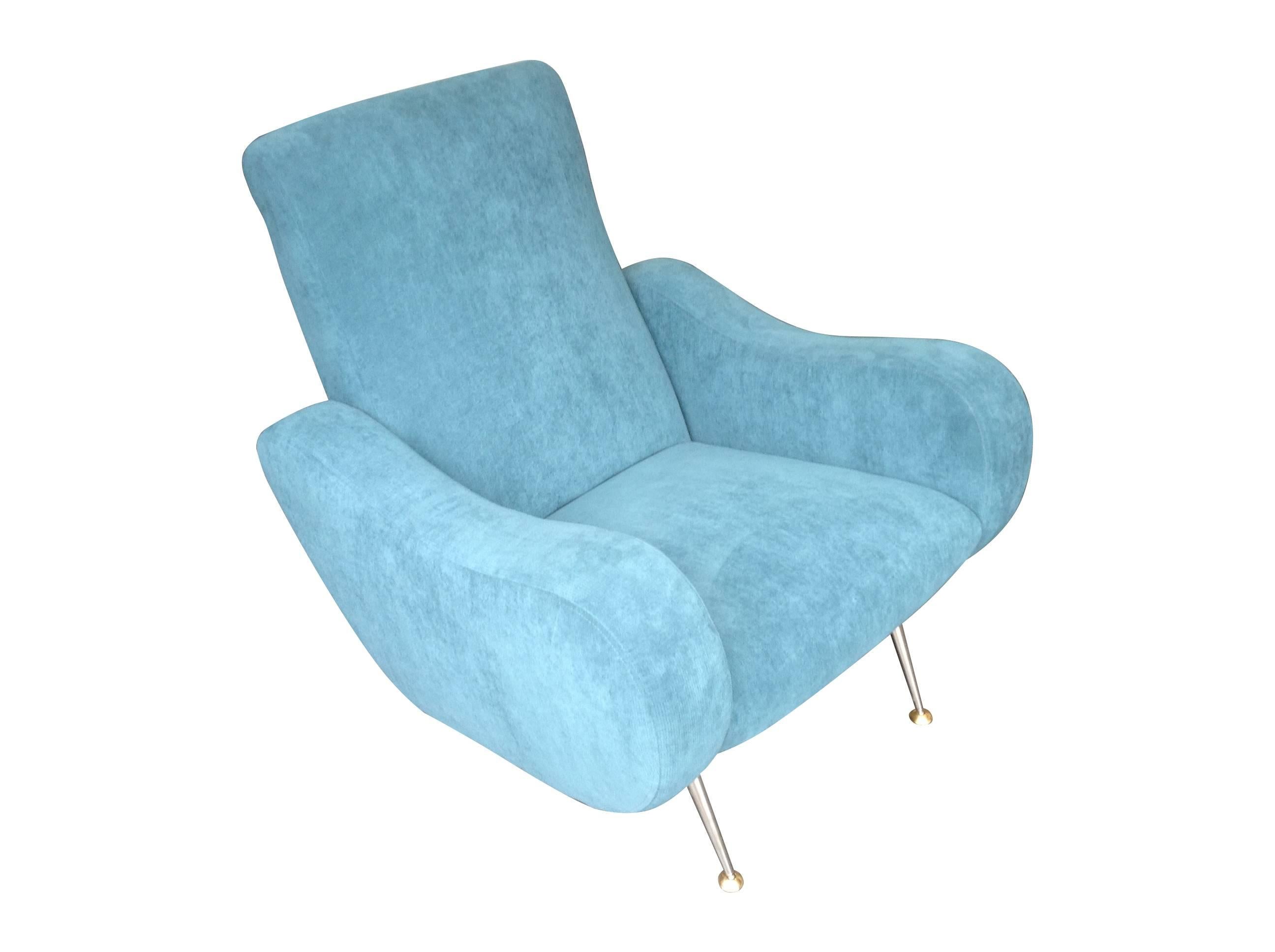 An unusual and very comfortable Gio Ponti style Italian armchair with brass legs, newly re-upholstered in blue fabric.