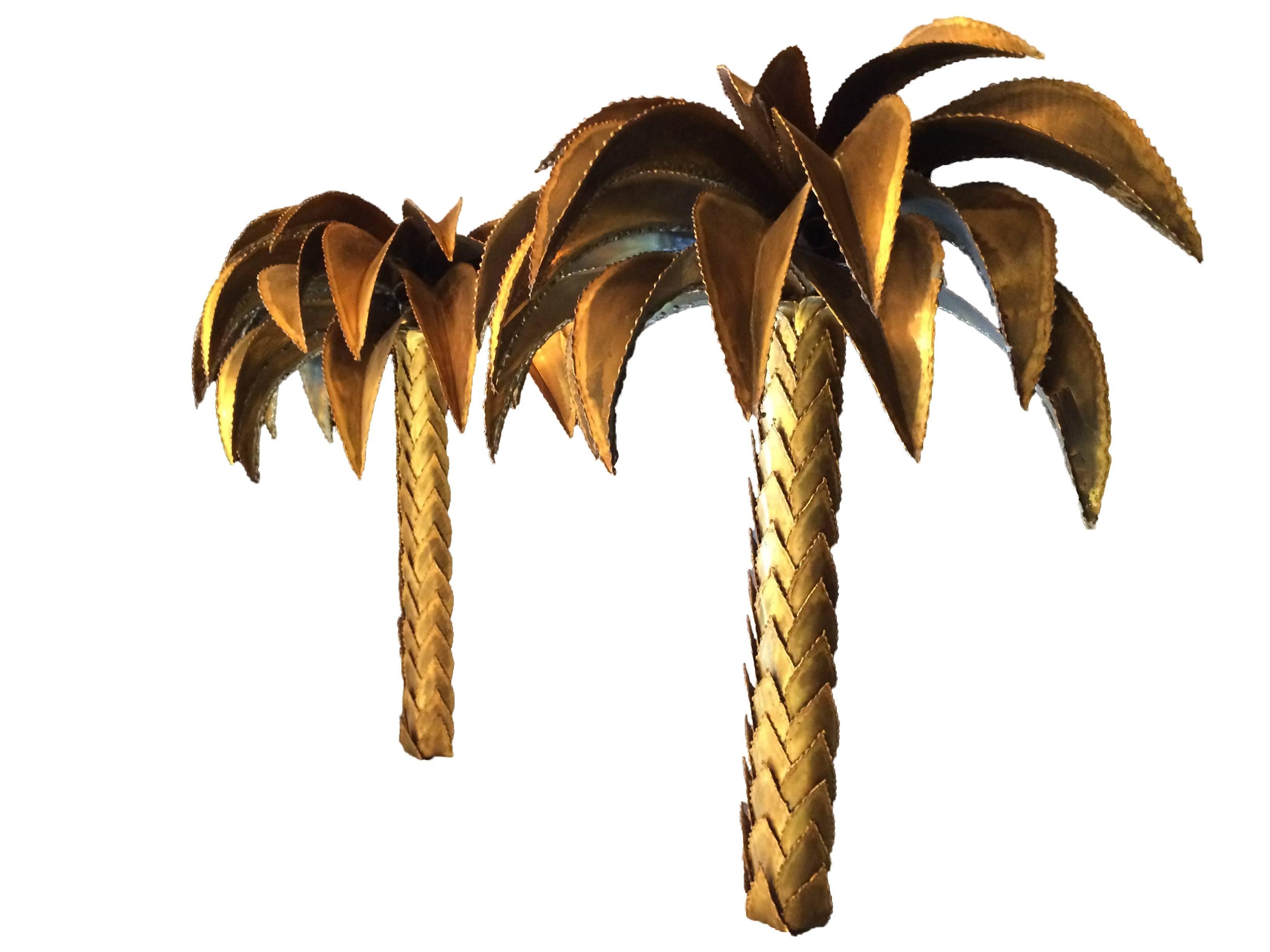 A pair of rare, large, original Maison Jansen brass, palm tree wall lights, each with two lights under the leaves and one central one on top. Each one is beautifully made and stunning quality and have been completely rewired with new bulb holders