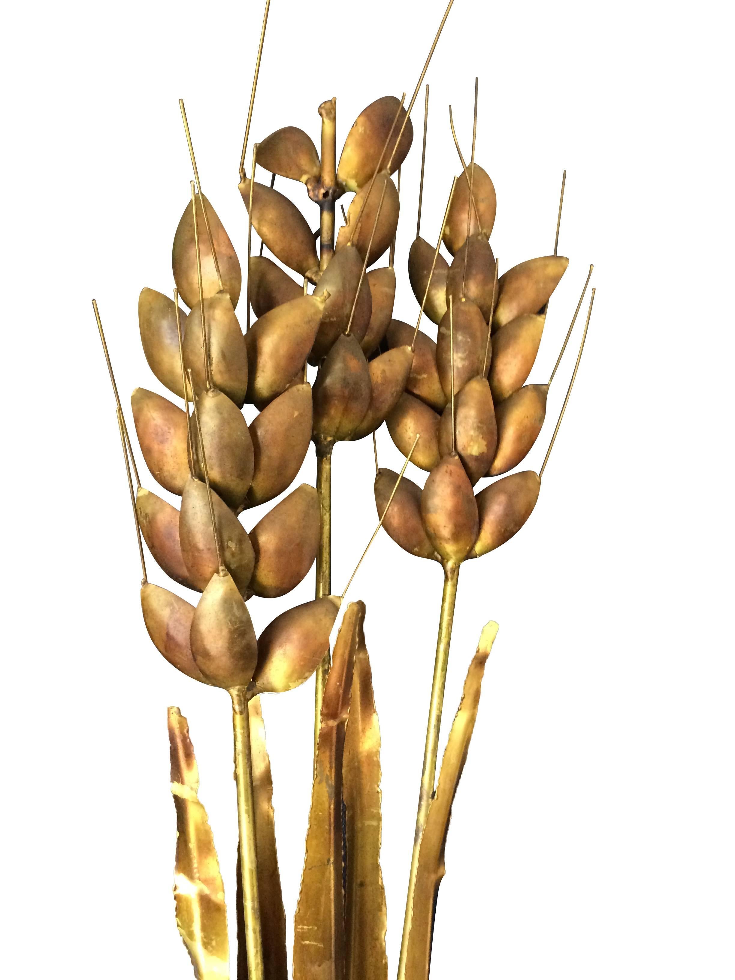 A Curtis Jere style, large, gilt metal wheat sheaf wall sculpture.