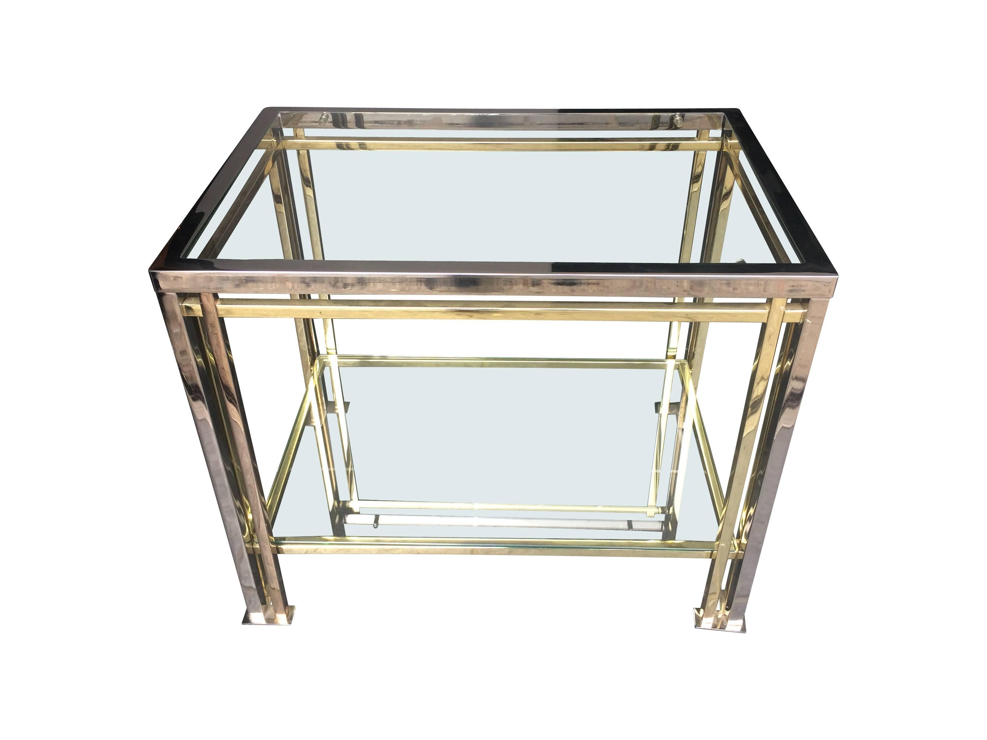 A Romeo Rega brass and chrome side table, with two glass shelves. 
Also available is similar style matching side table in castors see other listing.
