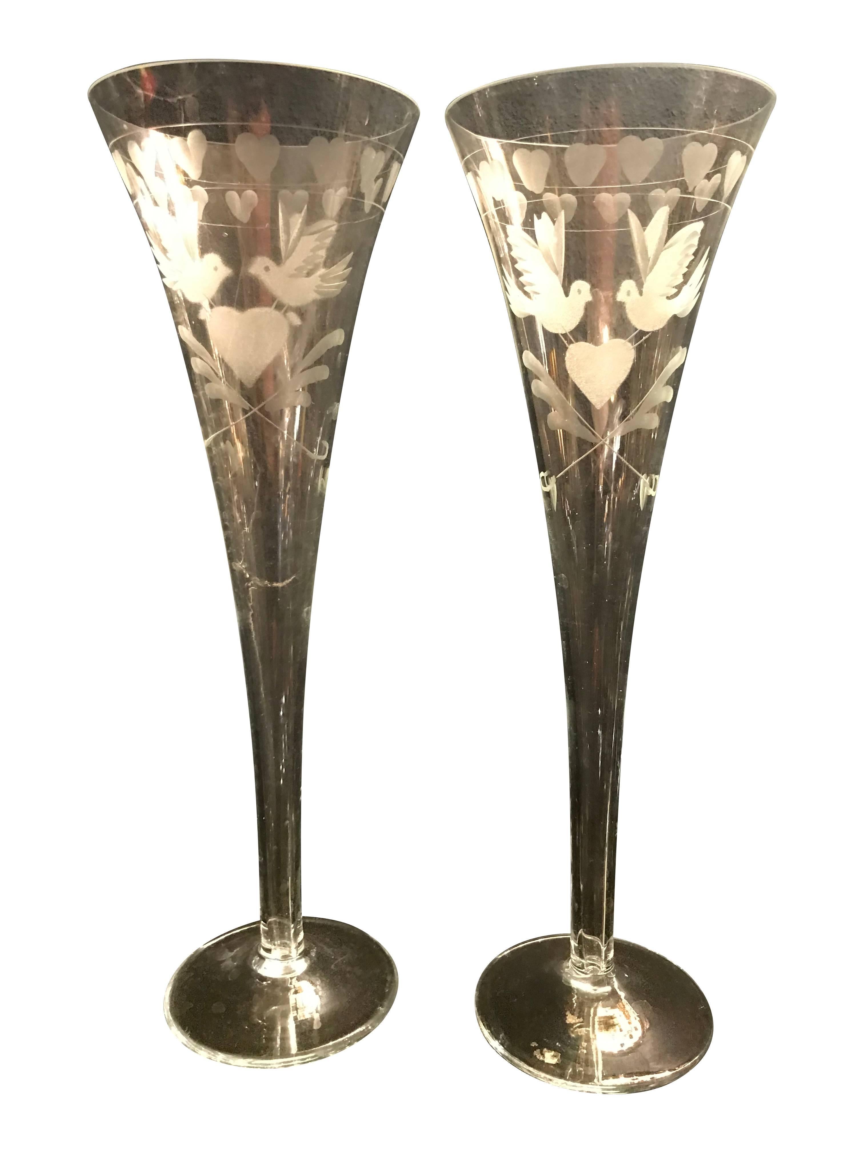 Beautiful, vintage, engraved French champagne flutes. Each engraved with 2 doves holding a love heart, also with love hearts around the rim. All in perfect condition and available individually, 11 available. Perfect for wedding, engagement, or