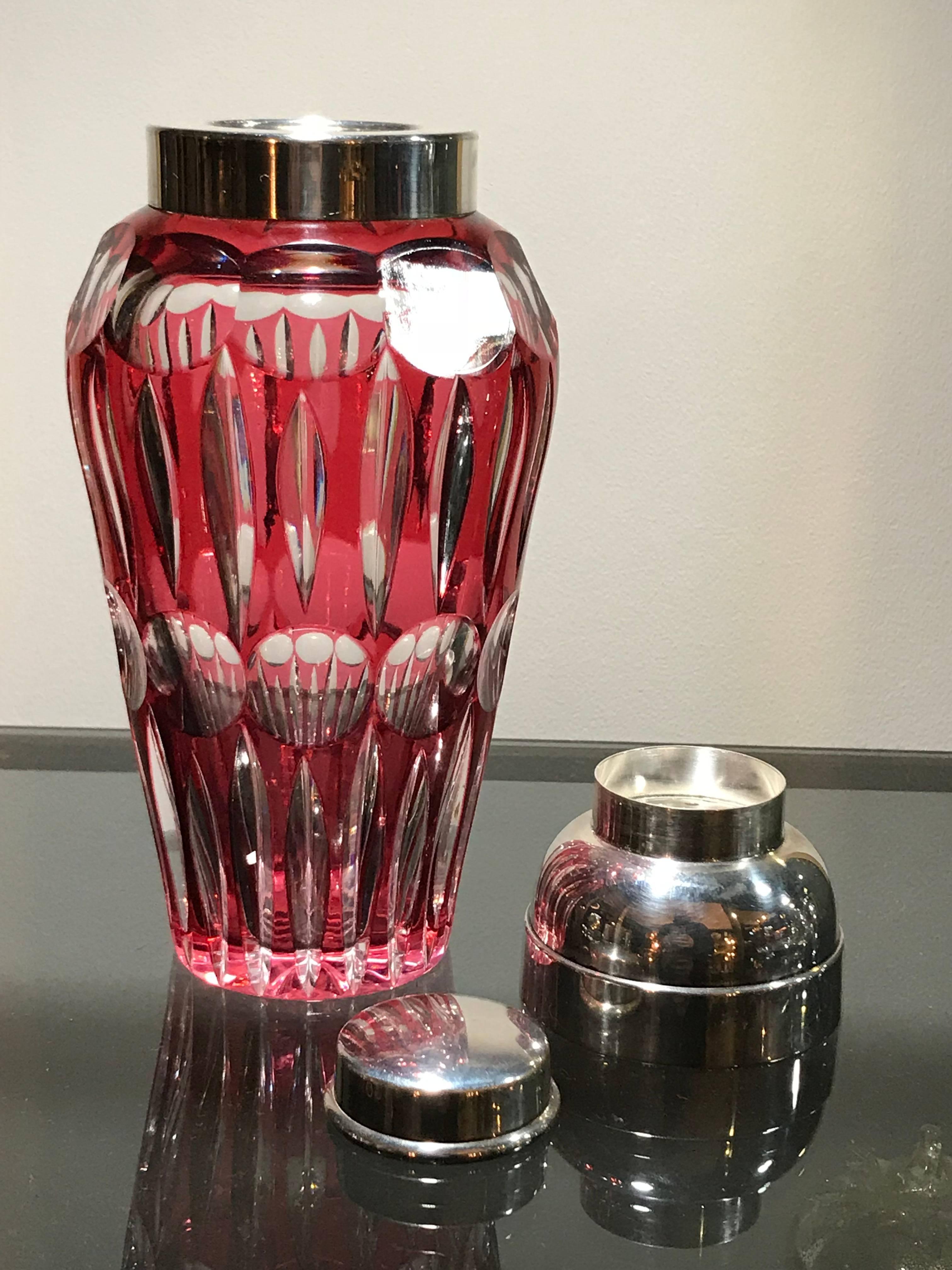 A cranberry glass cocktail Shaker with silver plated removable top and lid on a cut-glass base by Wilhelm Wolff.