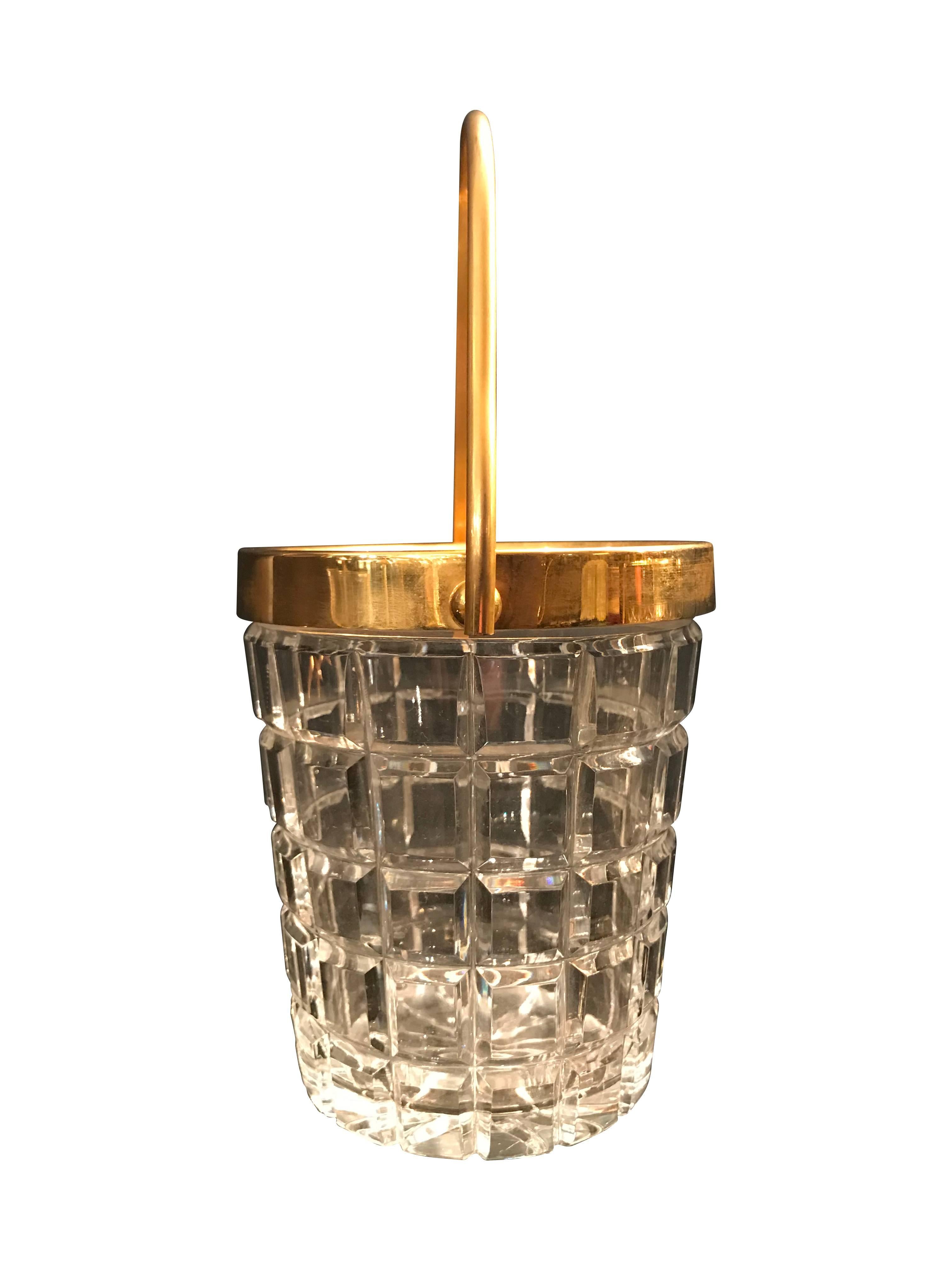 A Val St Lambert crystal ice bucket with gold leaf handle and rim.