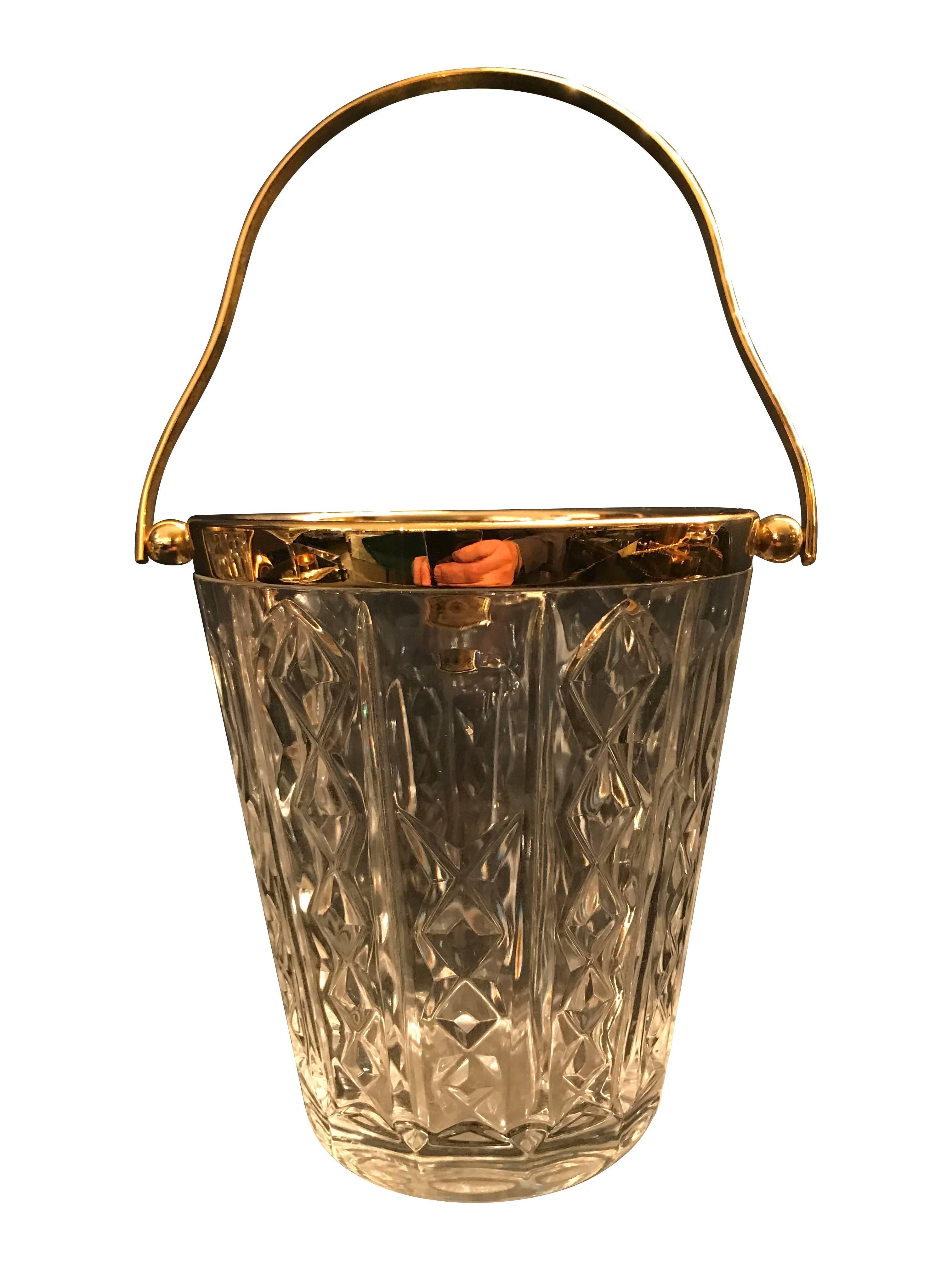 A Val St Lambert crystal ice bucket with gold leaf handle and rim. Stirrer and ice grabber in one photo not included in this sale. All can be mixed and matched to make great gift sets with glasses and other cocktail accessories.
