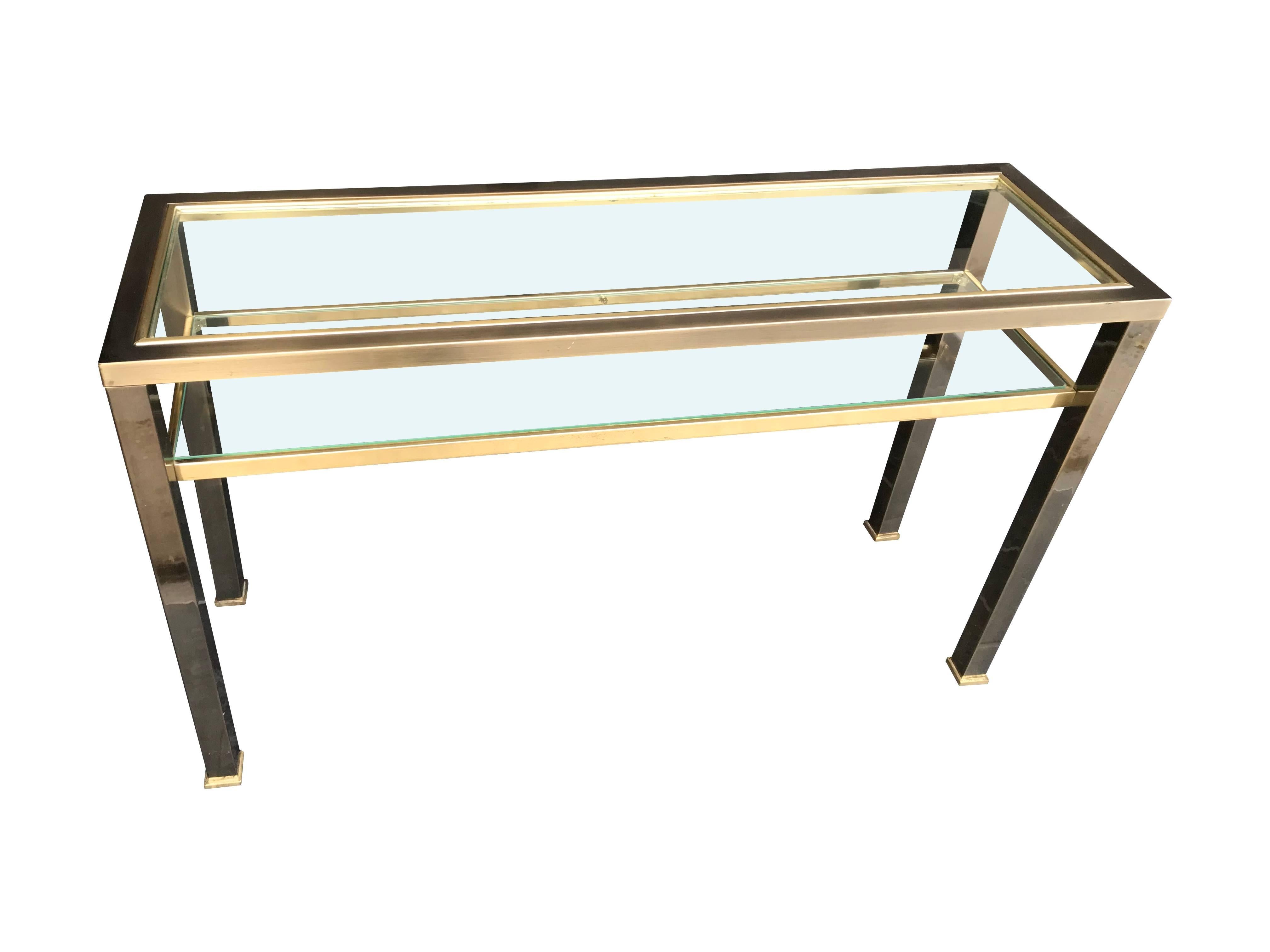 A Belgo Chrome console table with smoked brushed metal finish and brass with two glass shelves.