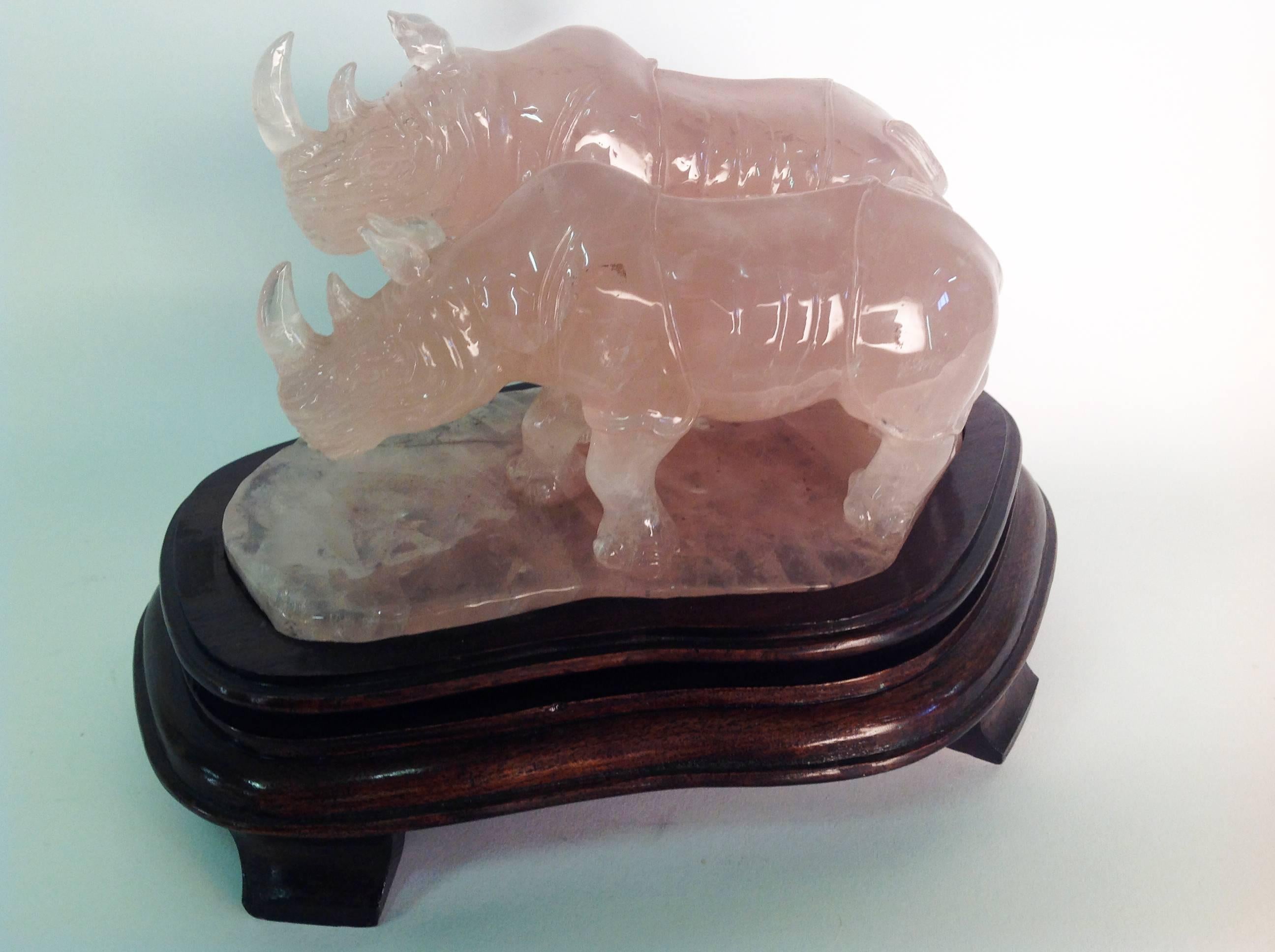 A beautiful rose quartz sculpture with wooden base produced in China. Italian private collection. Weight kg 5,700.