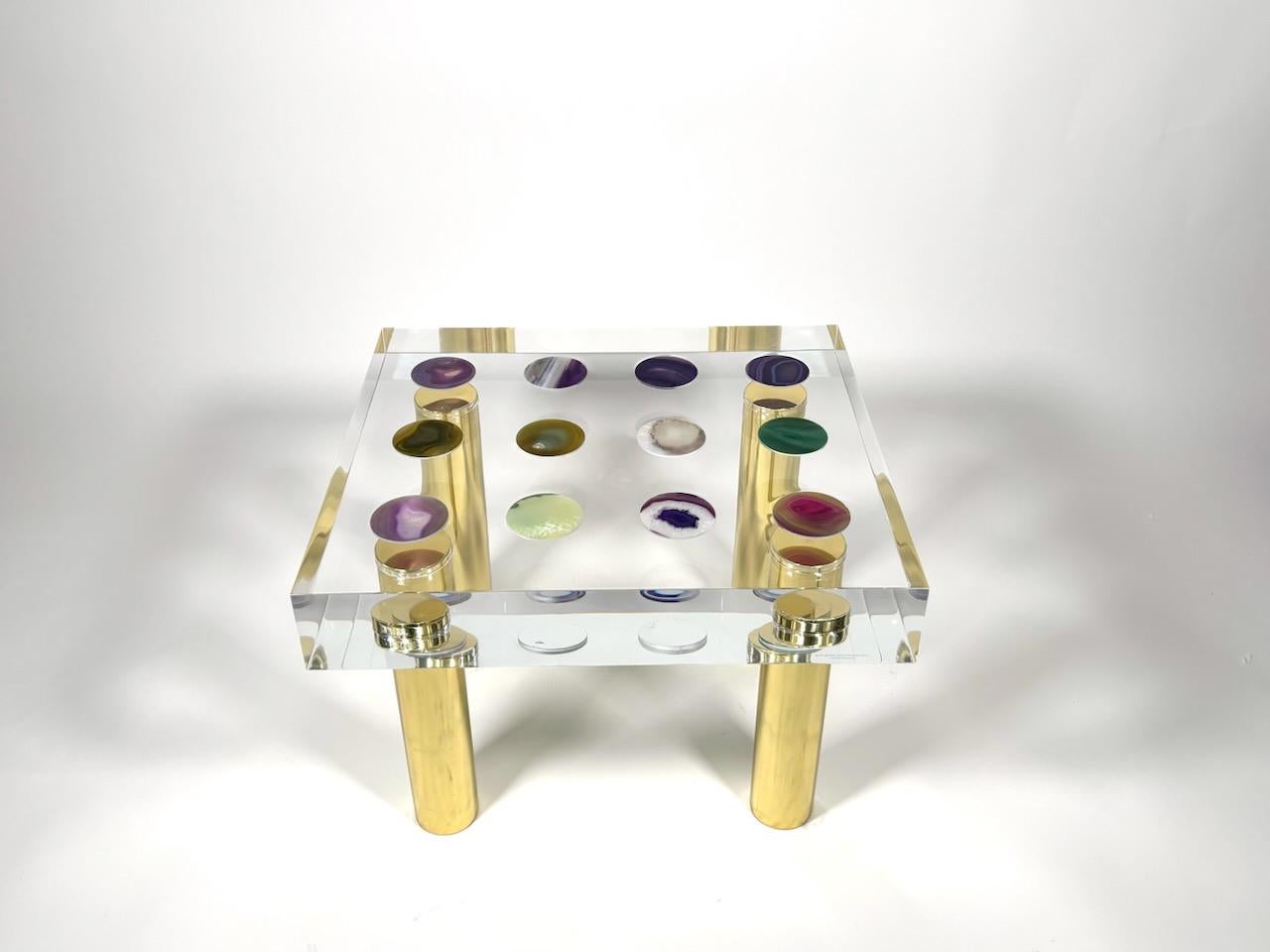 Struttura in vetro acrilico ridotta a forme geometriche di base, piano rettangolare con intarsi in agata, quattro gambe in ottone lucido disegnate da Studio Superego per Superego Editions. Firmato.

Biografia
Superego Editions è nata nel 2006,