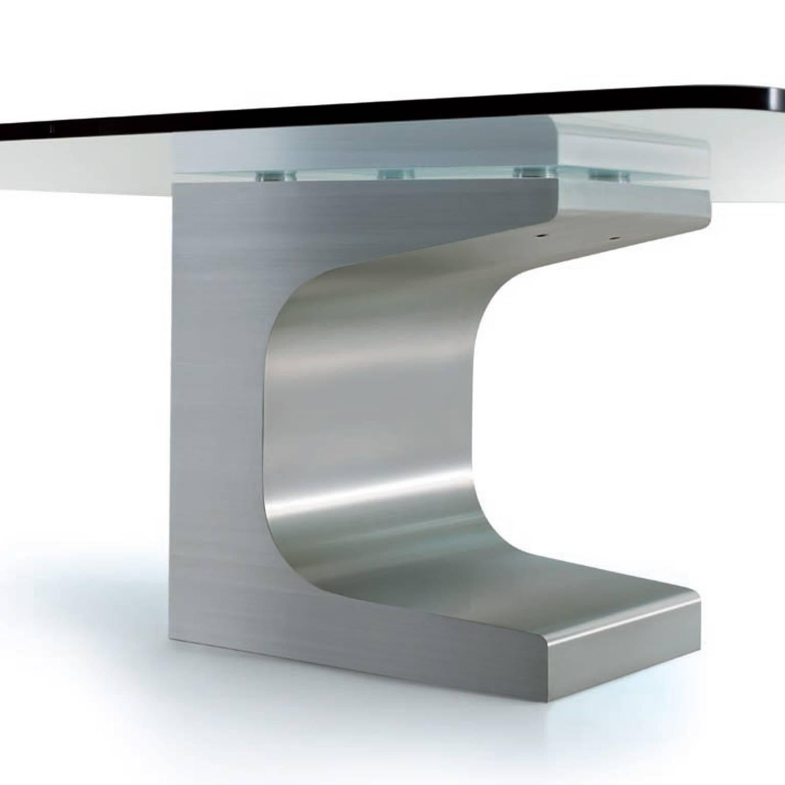 Table Niemeyer 1985 with tempered glass tabletop and a single sculptural leg made in wood covered with brushed stainless steel, with internal counter-weight plates. Designed by Oscar Niemeyer and produced by Estel in Italy.