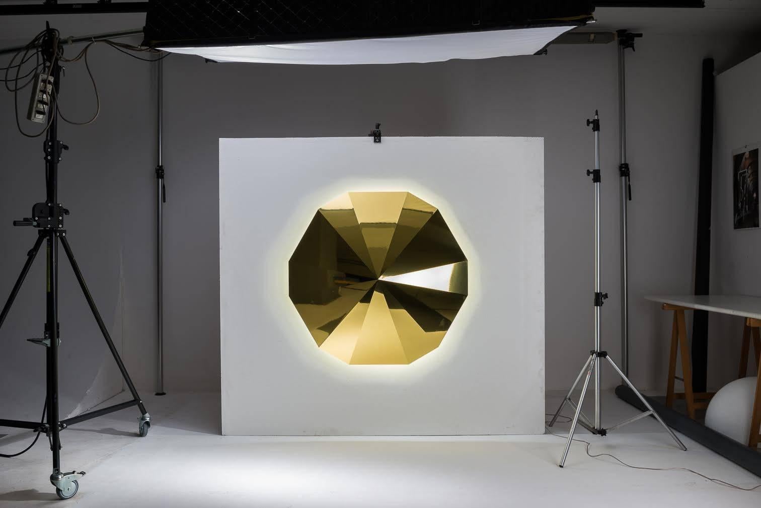 Wall light large, made of brass or aluminium gold finish with LED lighting. Through the study and application of sacred geometry, Gio Minelli creates with her bright work, conditions to induce the mind to silence and contemplation.