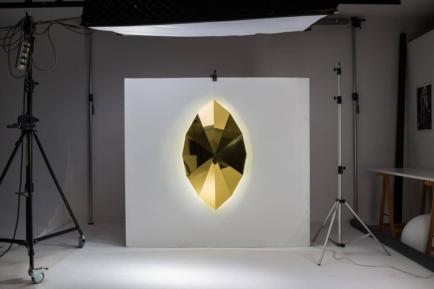 Wall light large, made of brass or aluminium gold finish with LED lighting. Through the study and application of sacred geometry, Gio Minelli creates with her bright work, conditions to induce the mind to silence and contemplation.

Biography
Gio