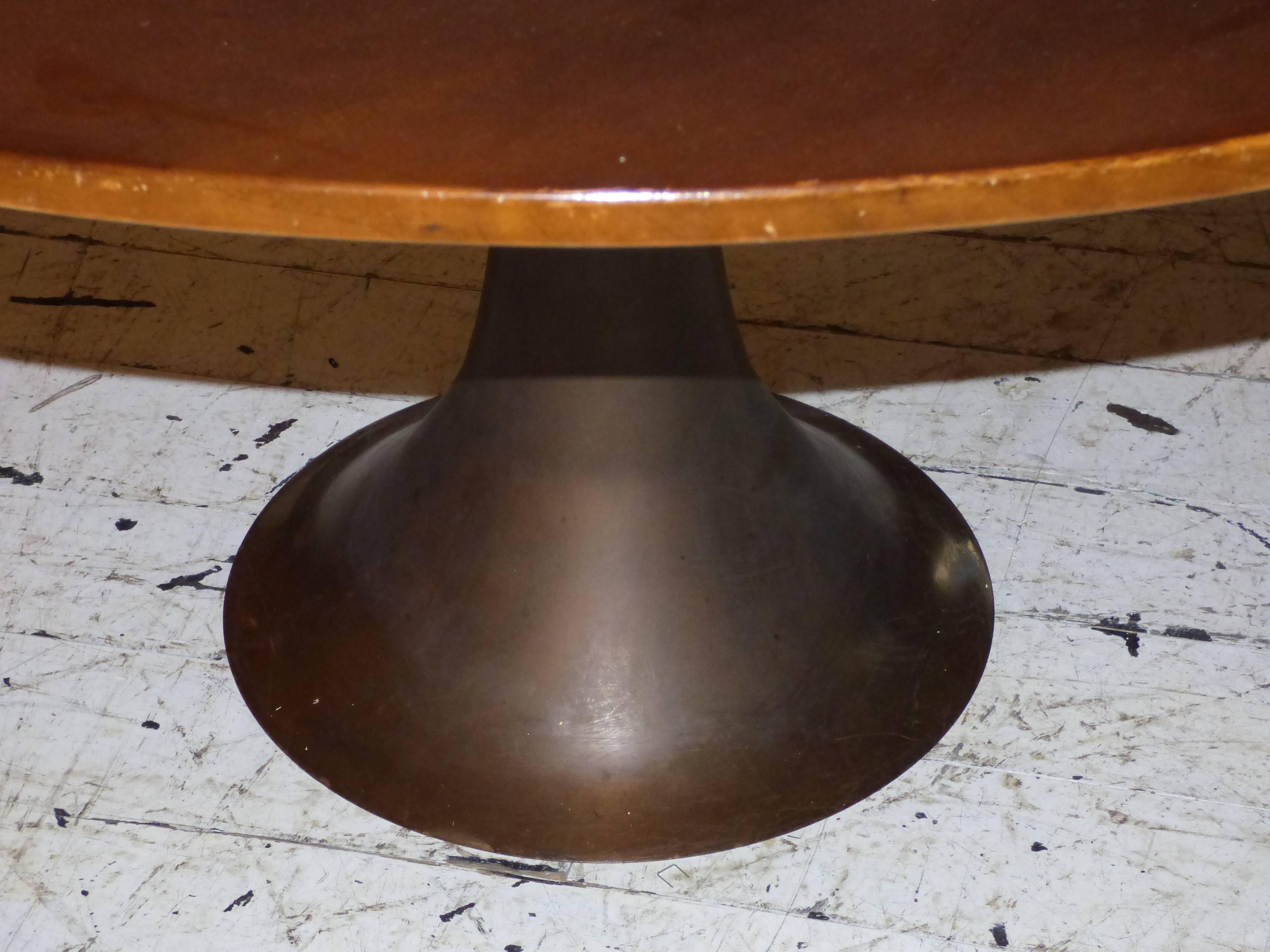 Table model 302 cast bronze finished on a lathe and wood floor designed by Angelo Mangiarotti and produced by Bernini in 1959.