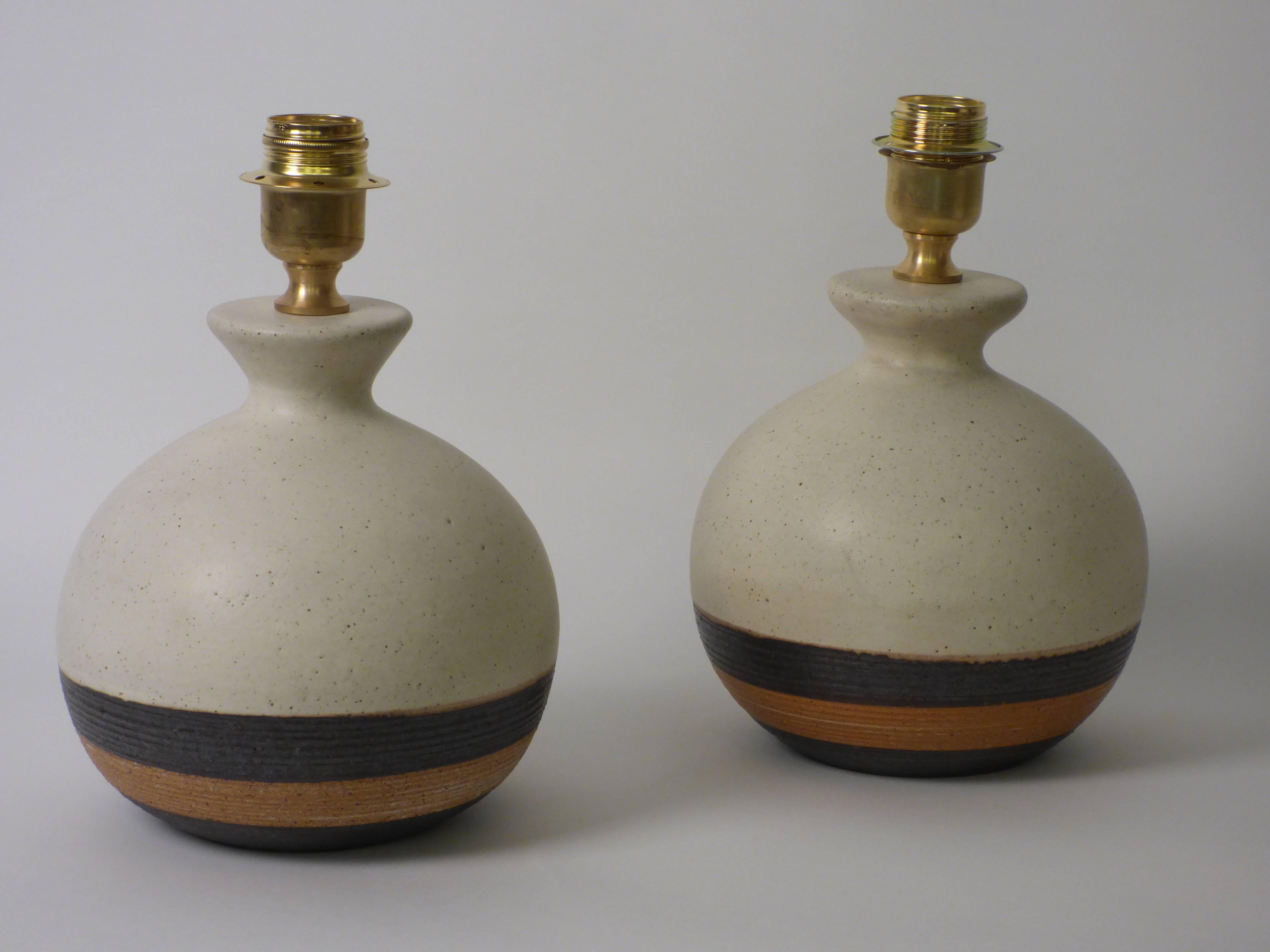 A pair of ceramic lamps designed and produced by Bruno Gambone. Signed.