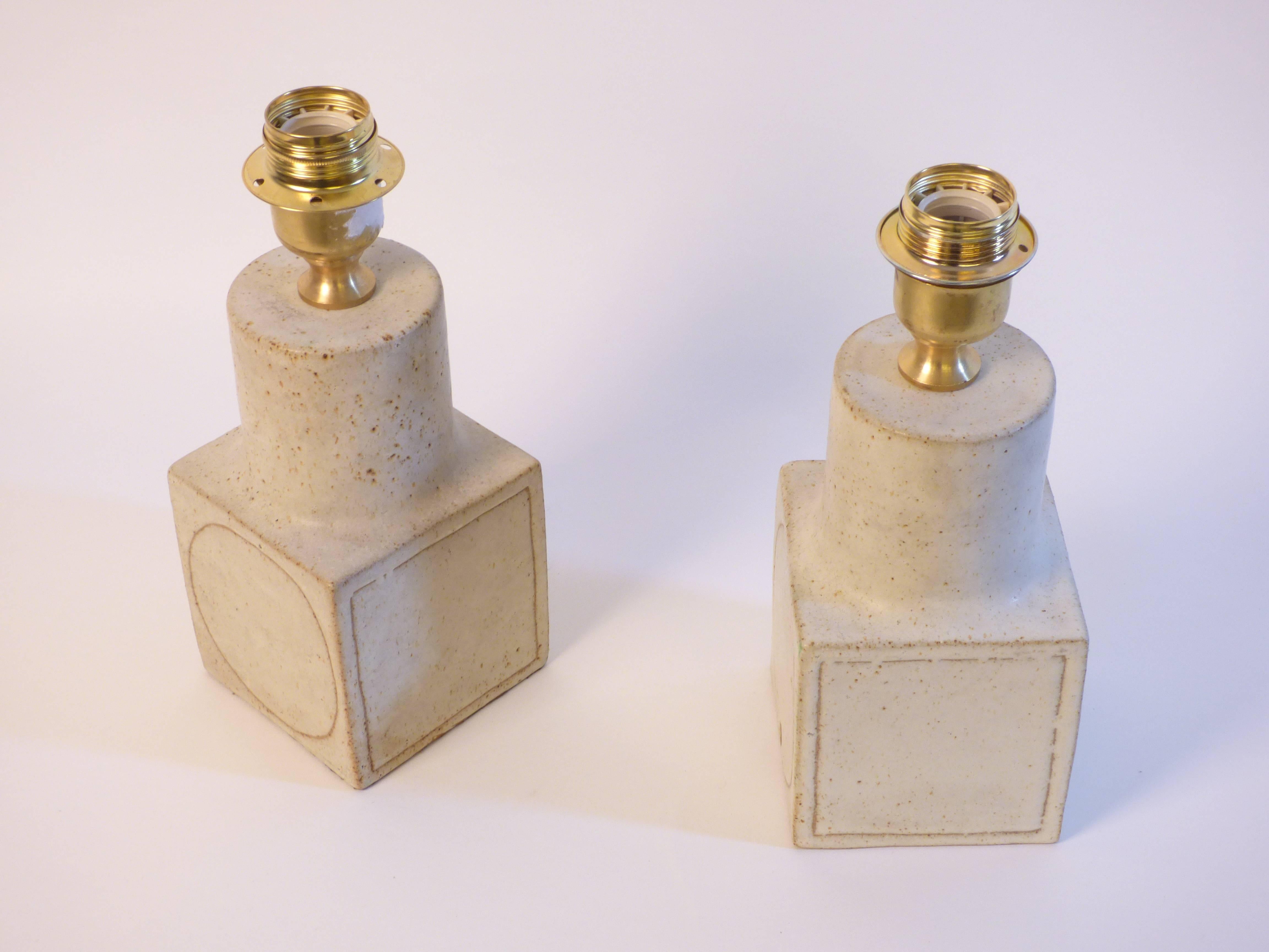 A pair of ceramic lamps designed and produced by Bruno Gambone in 1970 circa. Signed.