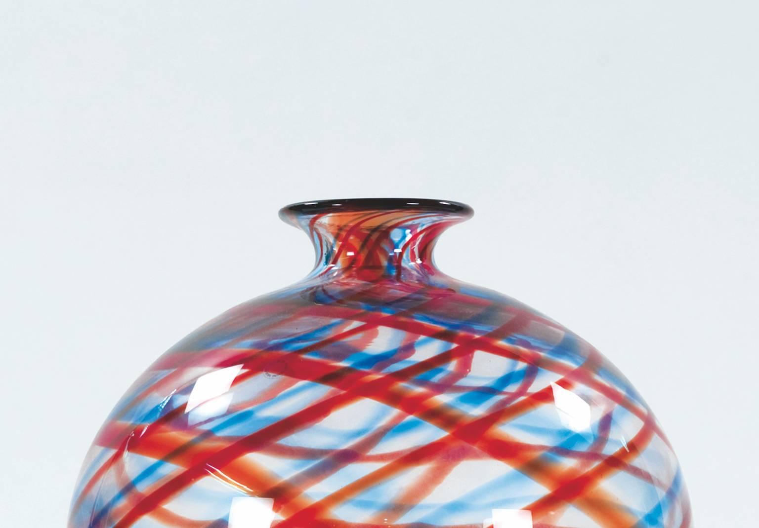 Large vase Simirone in blown glass intertwined polychrome canes on a base in faceted glass block designed by Alessandro Mendini for Venini in circa 1989. Limited edition of 50 pieces. Signature on the base and authentic