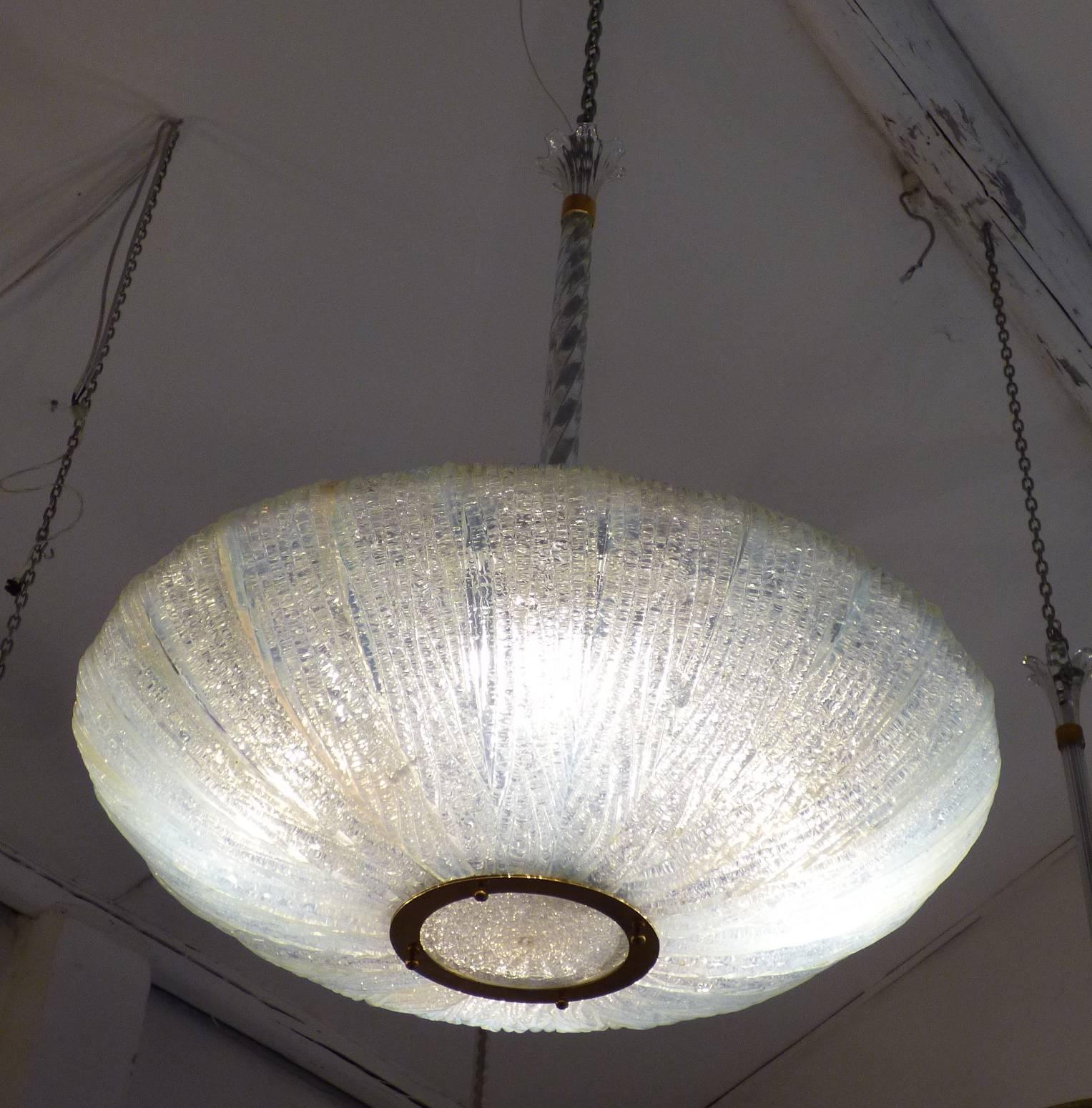 A beautiful Murano glass chandelier with brass structure and painted metal produced by Venini in circa 1930. 
Bibliography: Modello simile A. Venini Diaz de Santillana, Venini catalogo Ragionato 1921-1986, Skira, 2000, p. 261.