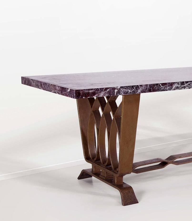 Forged iron dining room table with marble top designed and produced by Pierluigi Colli in circa 1940, Italy.