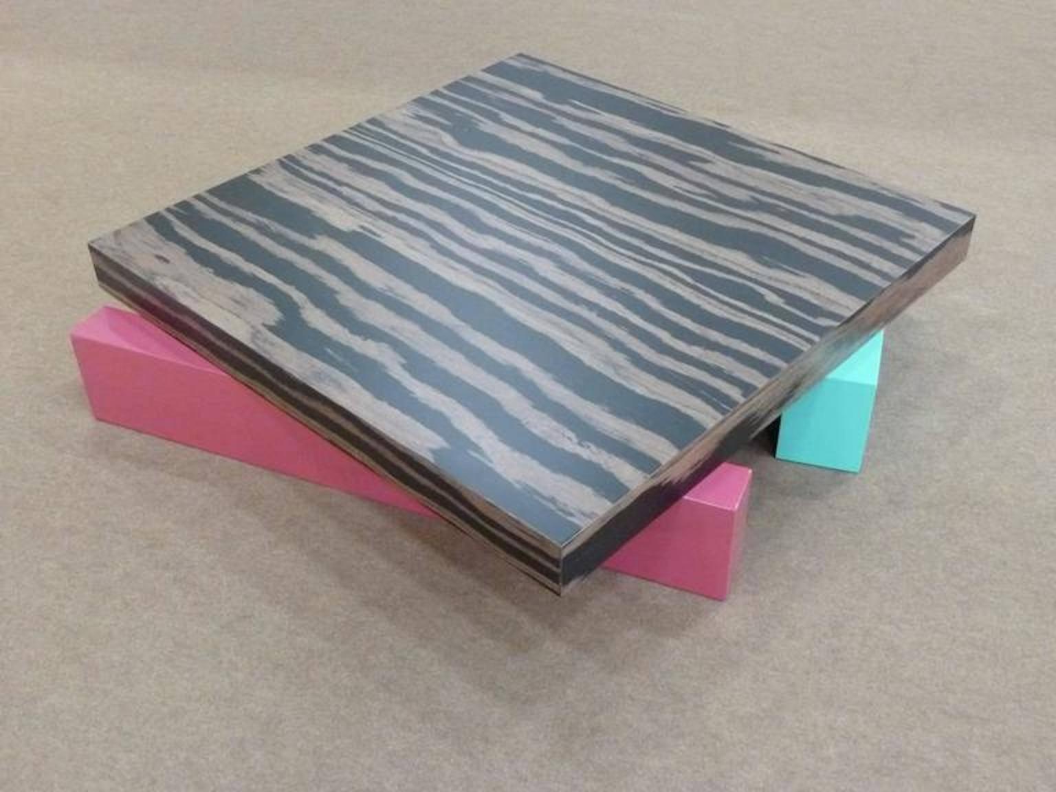 A beautiful coffee table in laminated wood designed by Ettore Sottsass for Alessi, circa 1990.

Biography
Ettore Sottsass (Italian, 1917–2007) was an architect and designer, labeled the godfather of Italian design. Born in Austria and raised in