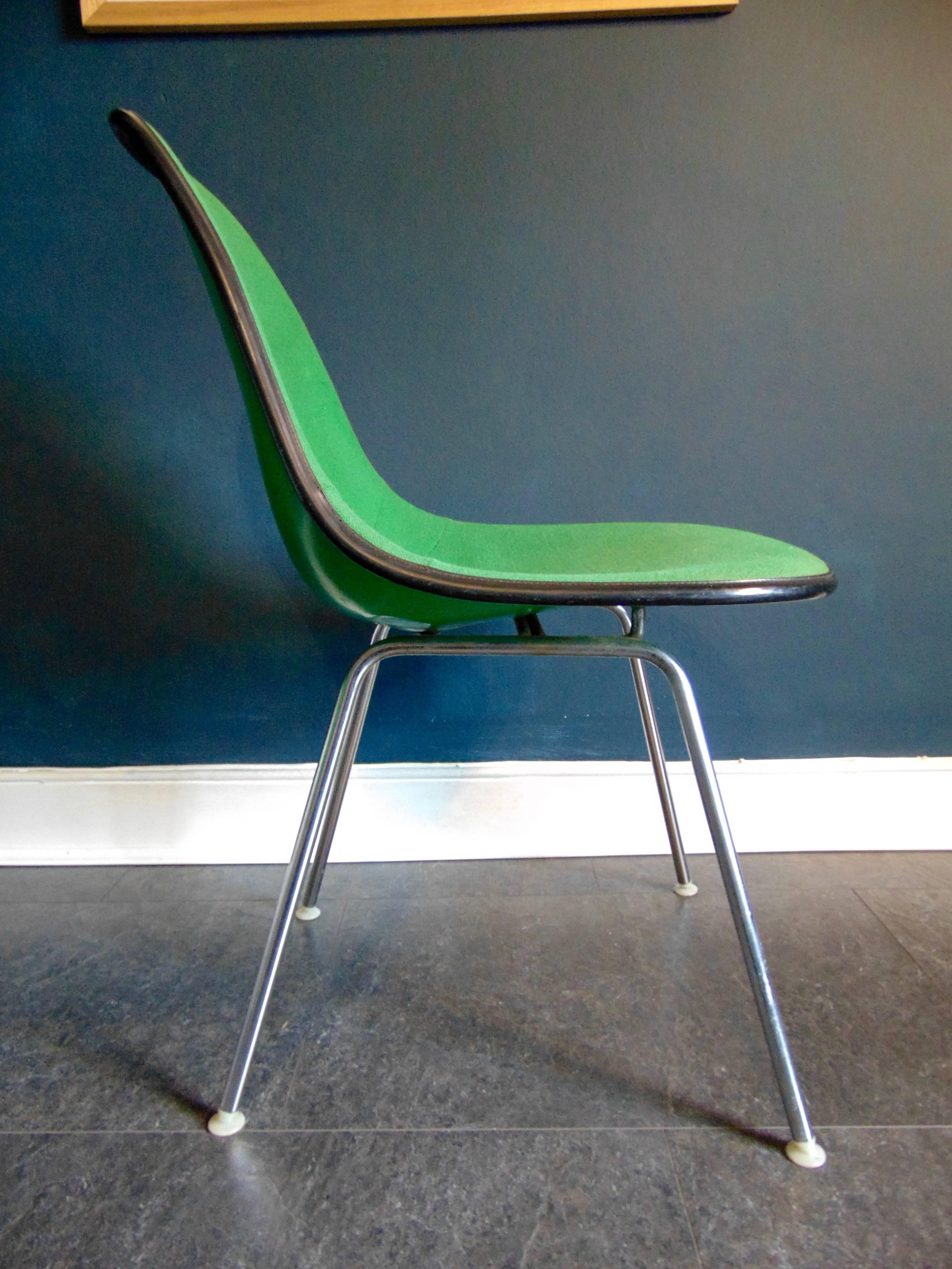 A pair of vintage Charles Eames side chairs produced by Herman Miller during the 1960s.
Green moulded fibre glass shells with cushioned seats, original upholstery on steel H base legs with nylon feet.
Two chairs available, price is per