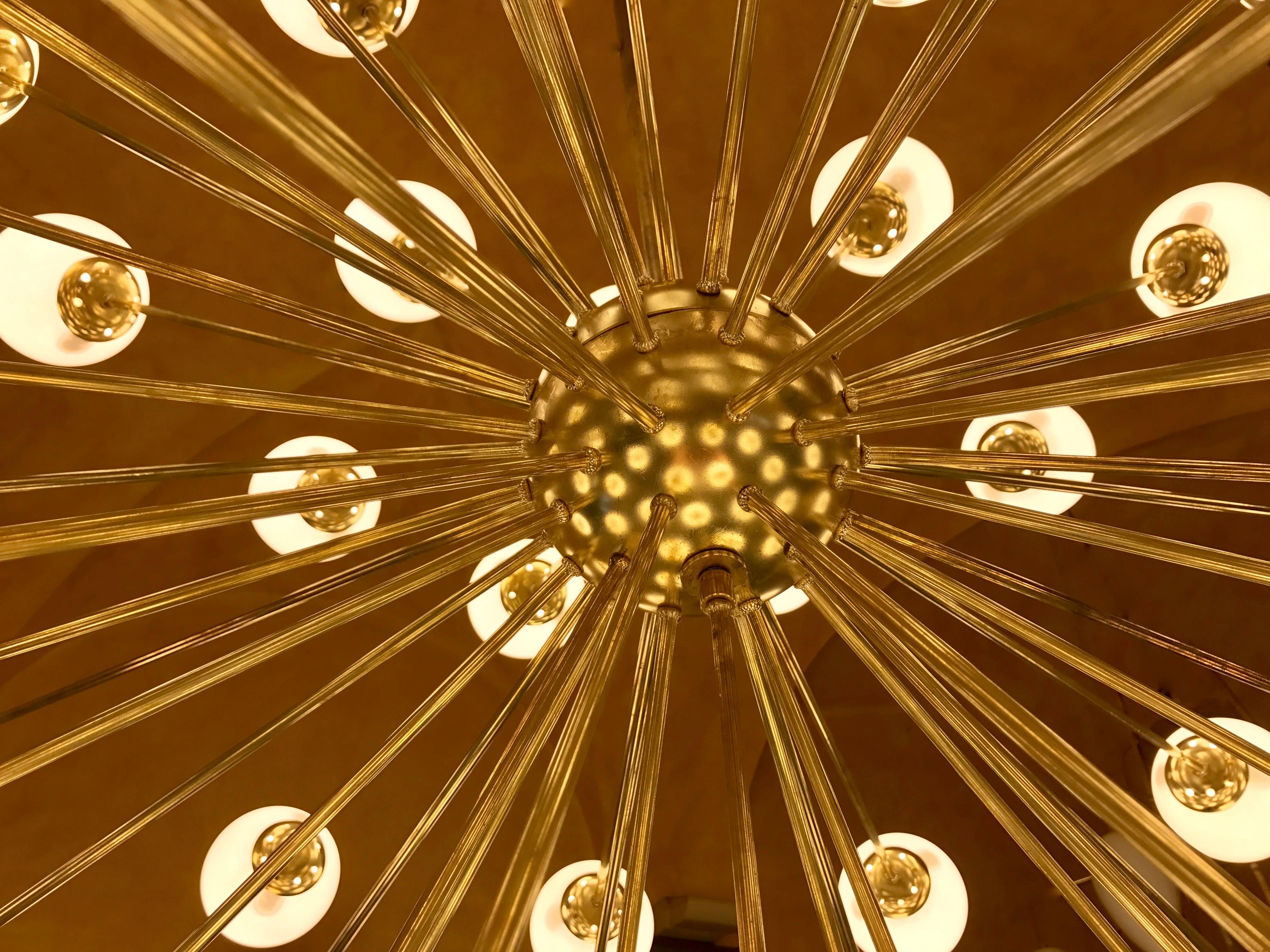 65 E14 light bulbs with brass clips to hold the opaline glass globe.