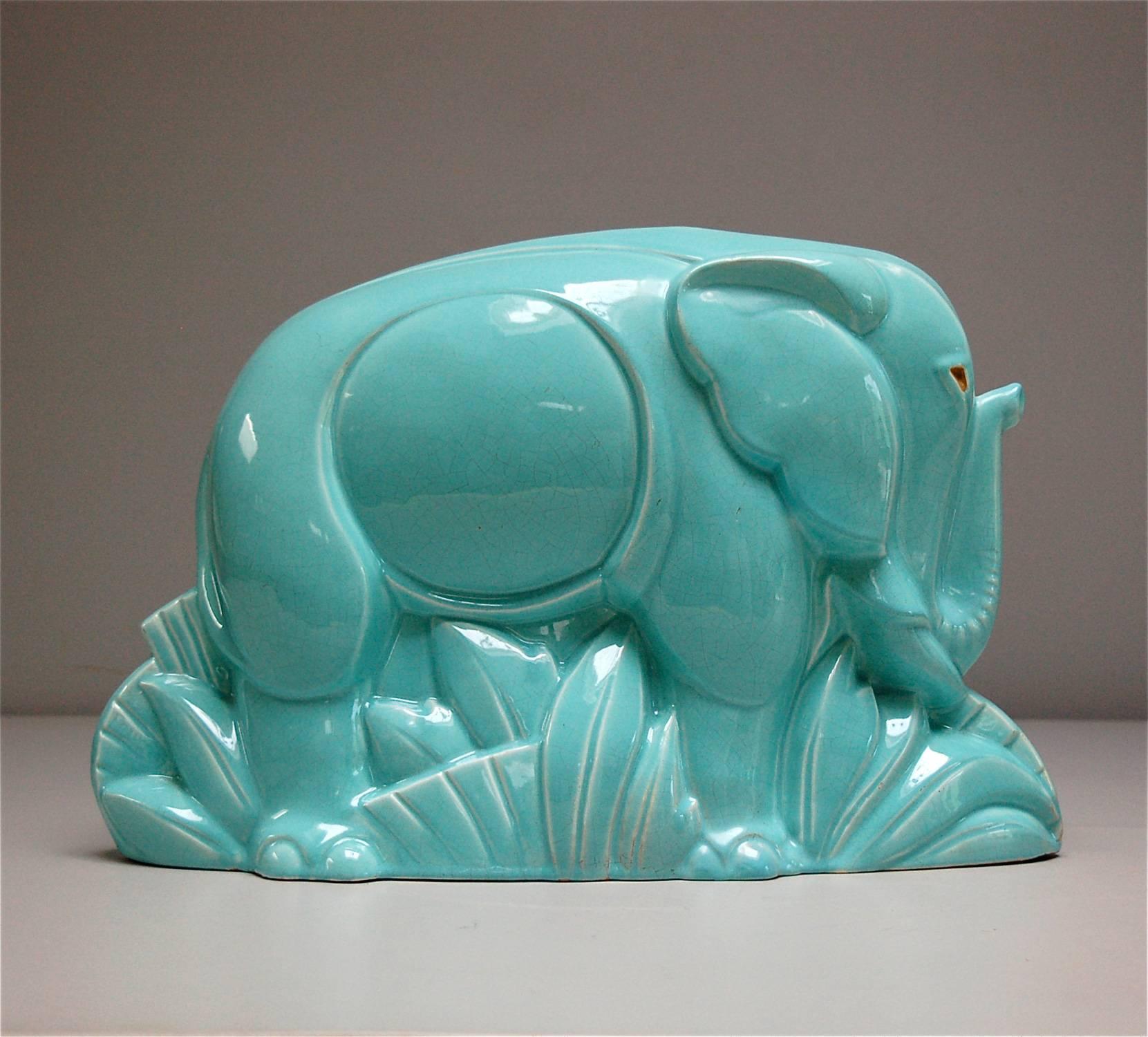 Charles Lemanceau is known for his animal sculptures and he is recognised as being one of the most important sculptors of the French Art Deco period. This crackle glaze ceramic elephant is a more rare edition in contrast to the smaller, white
