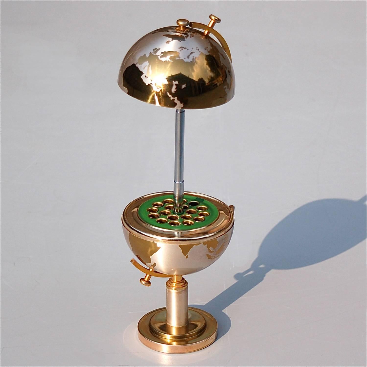 At first sight, you'd never imagine this shiny globe would morph into a cigarette dispenser. By a simple pull, the top hemisphere slides open revealing the inner compartment with room for 18 cigarettes. This lovely decorative item is very evocative