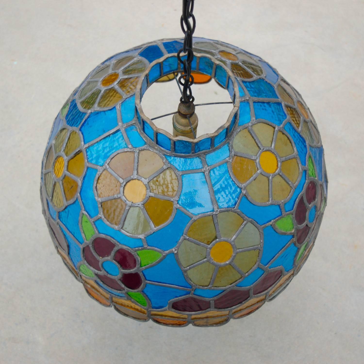 Colorful, completely crafted by hand, handmade stained glass pendant lamp with floral motif and scalloped edge or rim. This lamp has been carefully crafted by hand and because of the amount of glass and lead used is quite a weighty item at 9kg. It