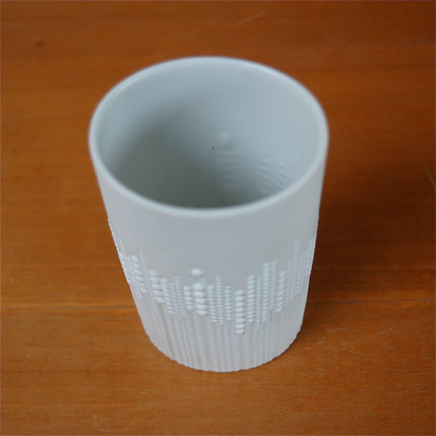 Porcelain pearl drops vase in mint condition designed by Tapio Wirkkala for the Rosenthal Factory based in Germany. The oval shaped vase has a matt white finish. The outer surface consists of carved vertical lines decorated with small round raised