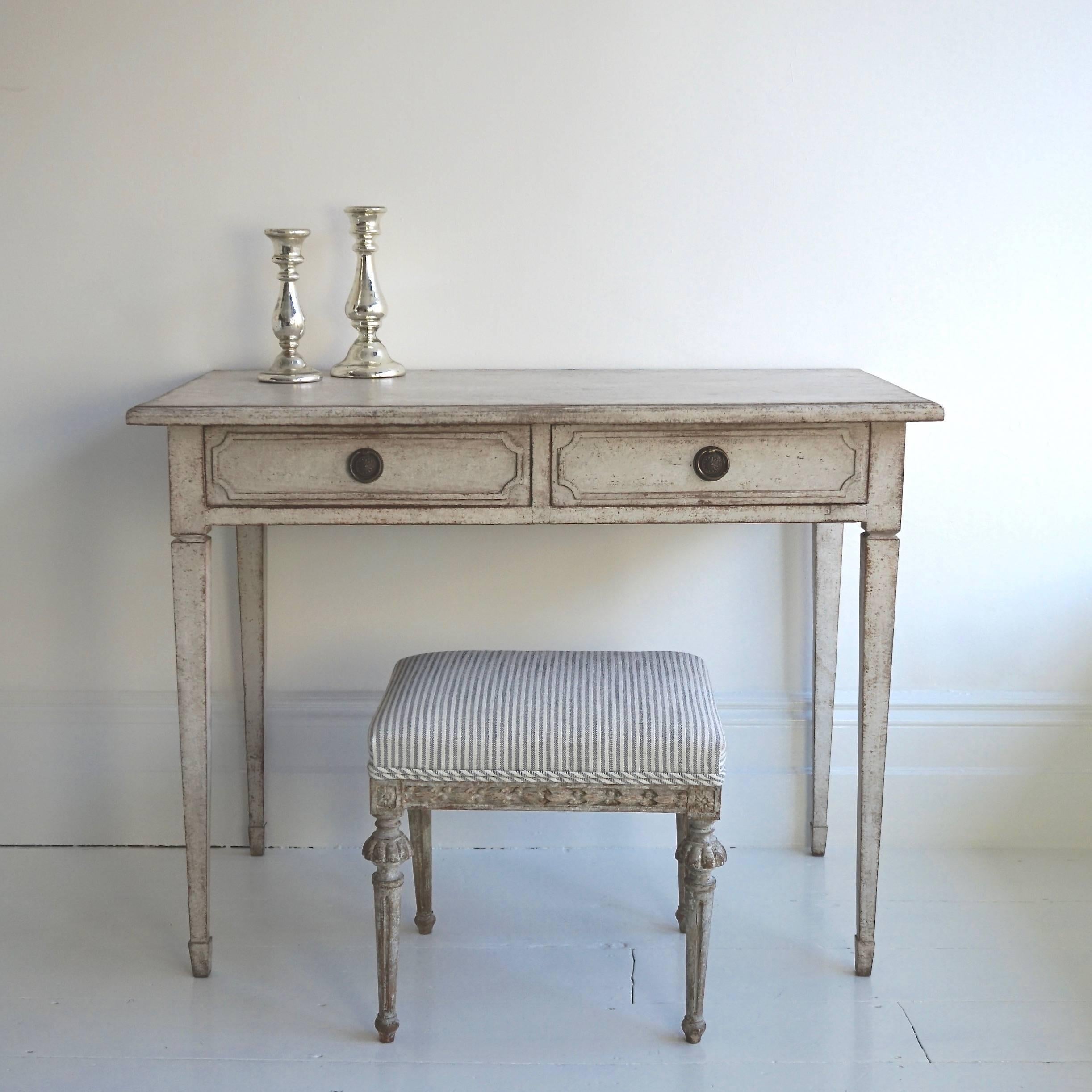 A wonderful Gustavian style desk, or side table with two drawers, standing on very elegant square tapered legs. Would also make a beautiful dressing table, Swedish, circa 1860.

Continental US shipping:
We ship to the United States quickly and