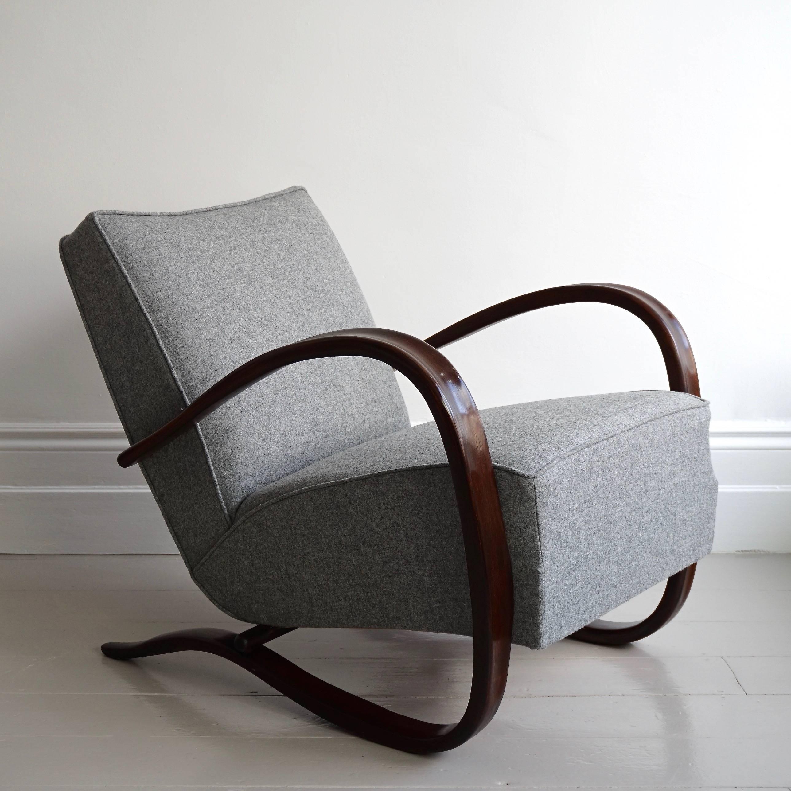 A stunning Czech designed H-269 Jindrich Halabala bentwood lounge chair by renowned German cabinet maker Thonet. This incredible armchair has been beautifully restored, and newly re-upholstered in a stunning Abraham Moon & Sons grey Melton wool.