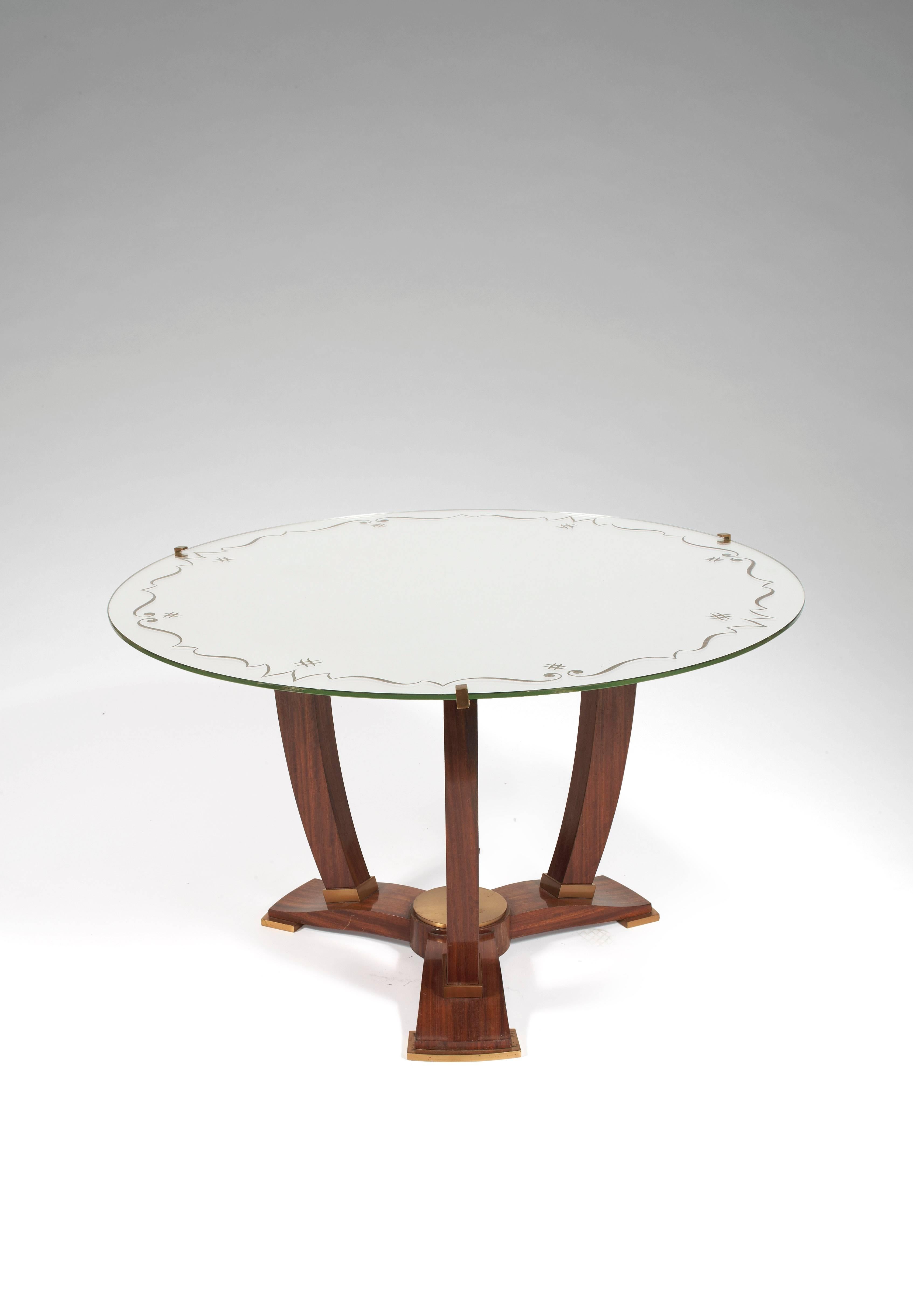Elegant pedestal table in mahogany and gilded bronze. Plate mirror with floral decoration, circa 1935.