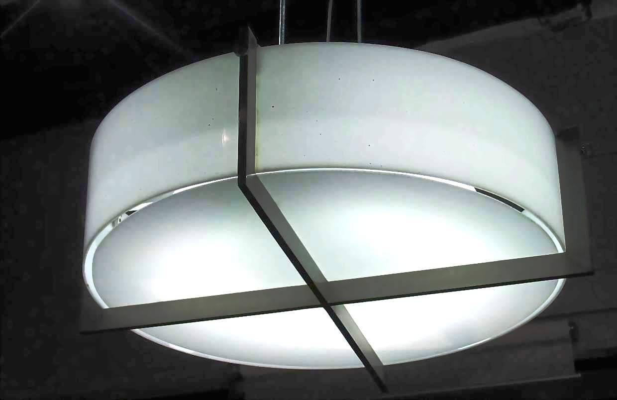 A pair of ceiling light, metal cruciform design, plexiglas.