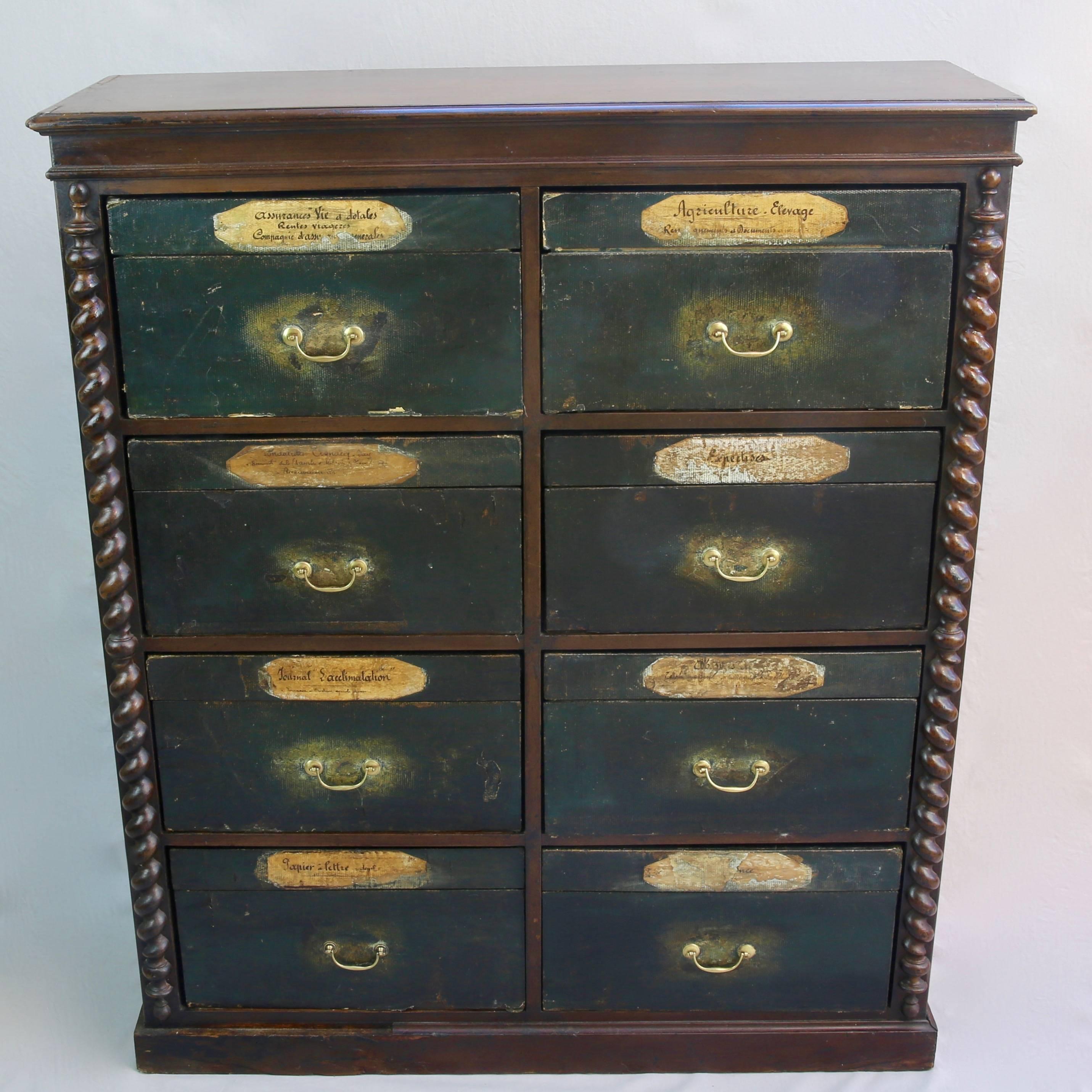 Rank and file: A provincial notaire's (French civil lawyer's) cartonnier having eight pull-out, heavy-grade card, lidded filing boxes housed within a tall mahogany carcass. Together with a well-patinated, deep teal, stretched-canvas drawered