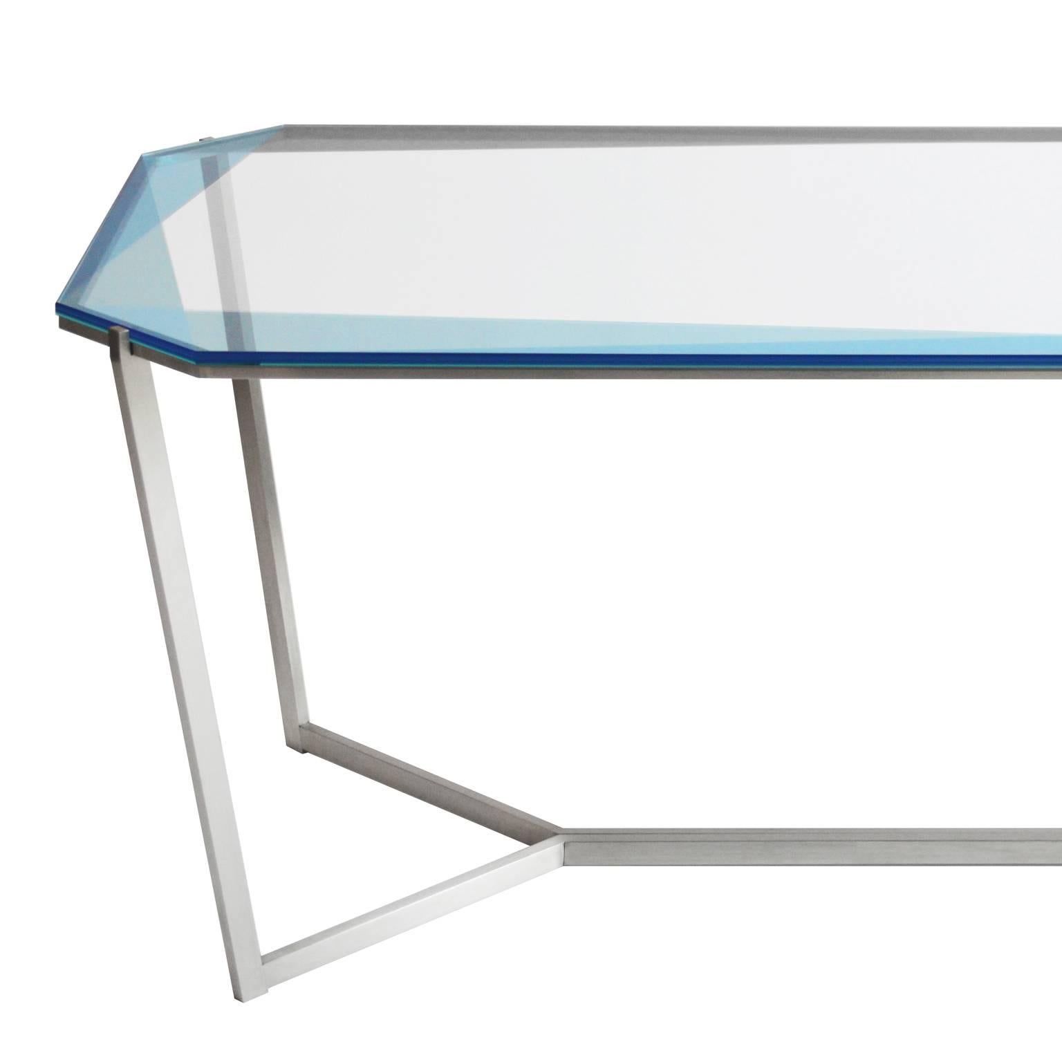 Our gem collection of tables are inspired by the reflections of light and transparencies found in gemstones. These metal and glass tables translate facets through layers of color and varying opacity. Each table base is designed as a setting with