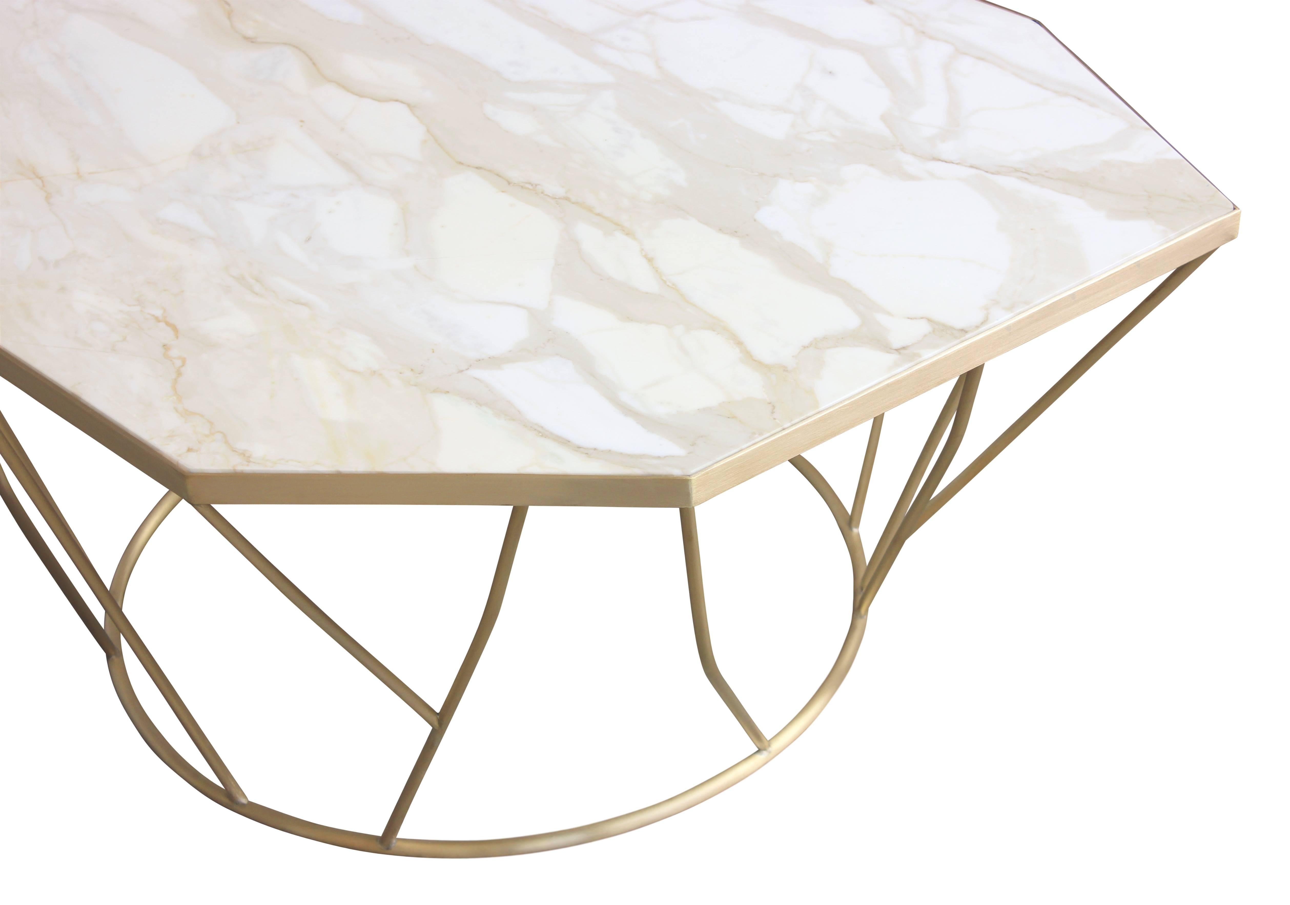 James Devlin Studio’s Facet Cocktail Table is a beautiful and sculptural piece comprising a custom shaped marble slab inlaid into a bronze frame atop a hand welded sculptural base. It presents a visually lightweight yet complex and stimulating