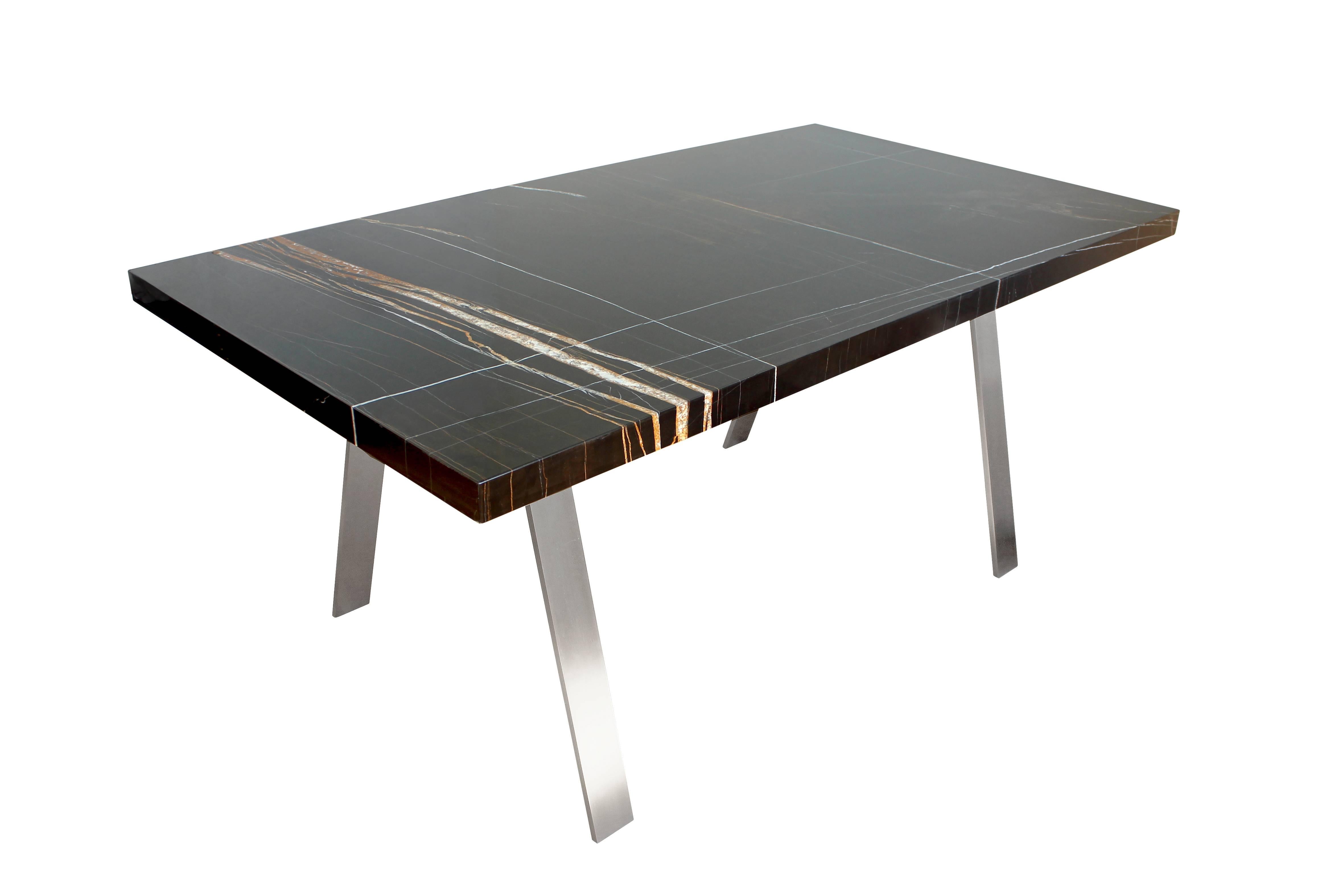 James Devlin Studio’s Adrian Dining Table combines a luxurious materials palate with a deceptively understated profile. The marble top features a two inch thick mitered edge profile that can be specified in an array of stones. The hand welded legs